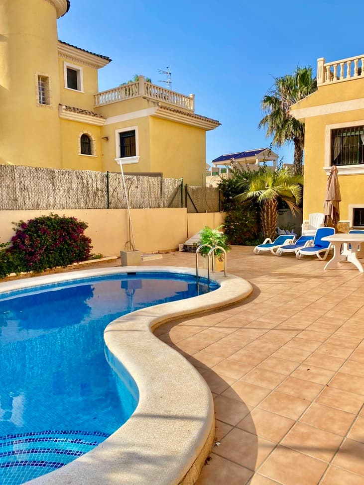  Semi-detached villa with private pool in Orihuela Costa | Spacious home, south-facing, fully furnished, ready to move in.Property OverviewThis three-level semi-detached villa is located in a quiet and established residential area Villamartín – Orihuela Costa, one of the most sought-after areas on the Southern Costa Blanca. The property is fully furnished and equipped, featuring a private swimming pool, garden, private garage, and a sunny rooftop solarium. Its strategic location makes it ideal both for year-round living and as a holiday or investment property. Layout and Main FeaturesTotal built area: 195.37 m²Usable (living) area: 160.44 m²Layout across 3 floors connected by an internal staircase:Basement: garage and recreation roomGround floor: living room, kitchen, access to the gardenFirst floor: bedrooms and bathrooms 3 double bedrooms with built-in wardrobes2 full bathroomsSpacious and bright living-dining areaIndependent kitchen fully equipped with appliancesLaundry room and storageSolarium, terrace, and balconyPrivate swimming pool of 21 m²Private gardenAir conditioningPrivate garage and communal parkingEnergy certificate: Class D Strategic Location in Orihuela Costa (Southern Costa Blanca)This property is located in one of the most desirable areas of the Southern Costa Blanca, ideal for year-round living, holidays, or rental investment. Everything you need is just a few minutes away, including top beaches, golf courses, shopping centers, and international transport connections. Key DistancesOrihuela Costa beaches (Playa Flamenca, La Zenia, Cabo Roig): 7–10 minutes by carAlicante International Airport (ALC): approx. 45 minutes (60 km)Murcia International Airport (RMU - Corvera): approx. 40 minutes (55 km)Zenia Boulevard Shopping Centre: 6 minutes by carNearby golf courses:Villamartín Golf: 5 minutesLas Ramblas Golf: 8 minutesReal Club de Golf Campoamor: 10 minutes Medical centers, pharmacies, and supermarkets within 5 minutesQuick access to the AP-7 motorway Why Invest in This PropertyBright and spacious south-facing homeQuiet and well-connected residential areaPerfect for permanent living or as a second homeHigh holiday rental potentialFully furnished and move-in readyLocated in a growing area with rising property valueInterested in This Property?Contact us for more information or to schedule a visit:Your new home on the Costa Blanca is waiting for you.