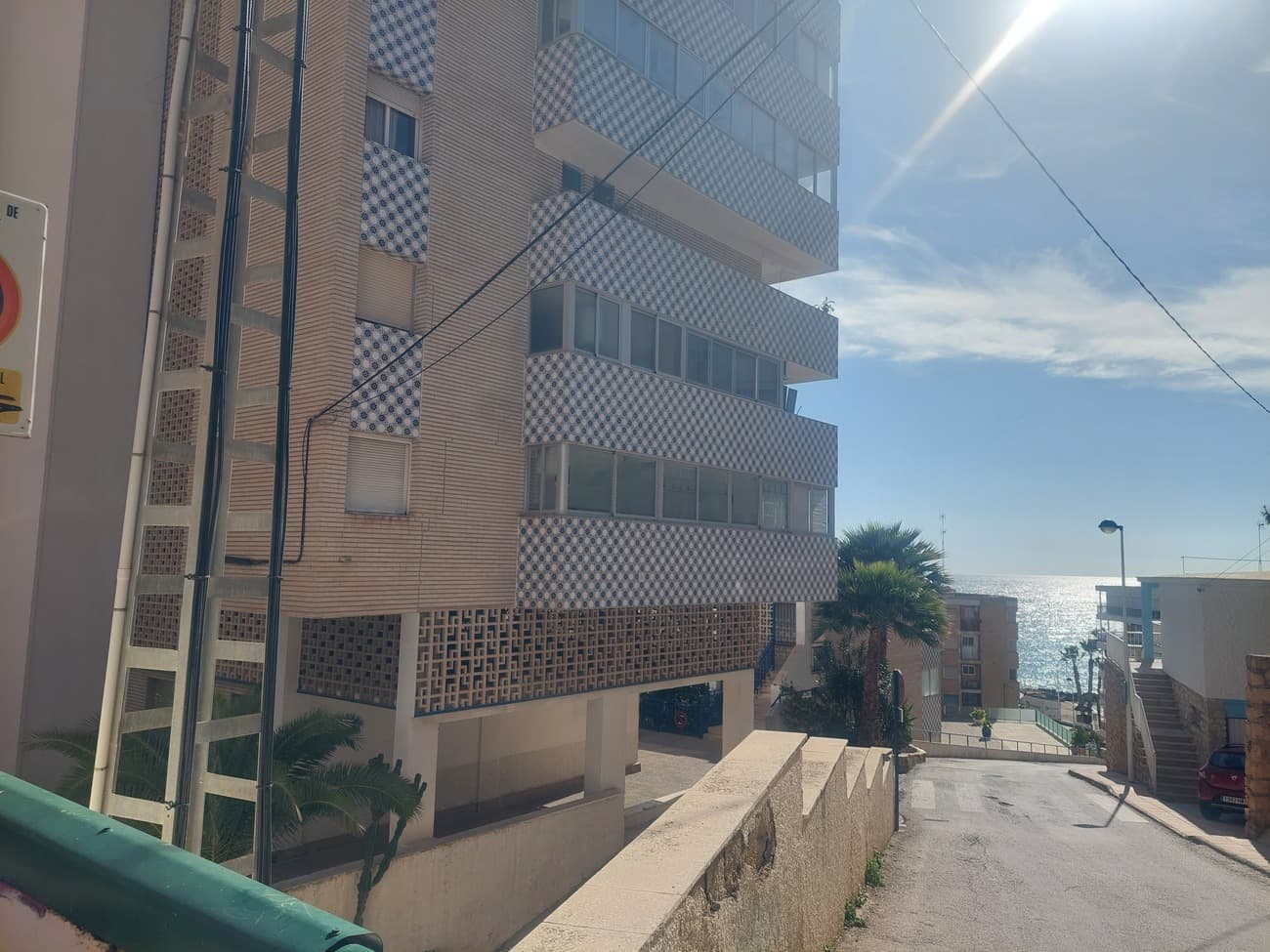 **Investor’s Dream – Renovation Opportunity with Incredible ROI Potential!**This **corner 1-bedroom apartment** with a **communal pool** and **breathtaking sea views** is an ideal investment property waiting for a renovation. Situated just **50 metres from the beach** in Cala de Finestrat, this apartment offers incredible potential to modernize and capitalize on its prime location.Whether you’re looking for a year-round residence, a charming holiday home, or a profitable rental investment, this property offers endless possibilities. With some updates, you can easily transform it into a comfortable full-time home, a serene seasonal retreat, or a stylish rental that could generate significant returns.Located on the **4th floor**, the apartment features a **spacious double bedroom** with built-in wardrobes, a **family bathroom**, an **open-plan American kitchen**, and a **bright living/dining area** leading to a **year-round terrace** with stunning sea views. The corner positioning provides an additional side terrace, perfect for extra storage, a laundry area, or to enhance the living space.The apartment already includes **hot & cold air conditioning**, **satellite TV**, **landline**, and **broadband** – all ready to go. The urbanization is equipped with **two lifts**, a **communal pool** with a shower, and a **large south-facing sun terrace** to soak up the sun year-round. Only steps away from **Cala de Finestrat's beach**, the apartment is within walking distance to essential amenities like shops, bars, restaurants, supermarkets, a pharmacy, bakery, bank, and bus stops. Community Fees: €650 for 6 months This includes water (as the apartments do not have individual water meters, it’s a fixed rate of approximately €35 per month).Basura (Waste Collection): €105 per year.Don’t miss out on this **fantastic investment opportunity** to achieve an excellent return on investment in a highly sought-after location!