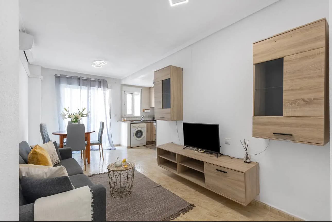 Unique Opportunity – Just 300 meters from Playa de los Locos and Playa del Cura!Bright and spacious apartment for sale with 73 m² of built area, perfect as a permanent residence or a highly profitable vacation rental investment, thanks to its unbeatable location just steps from the beach.Located on the third floor of a quiet, well-maintained 5-story building with friendly neighbors, the property features:2 comfortable bedrooms2 bathrooms (one full and one with a shower)Modern open-plan kitchenCozy living room with direct access to a small terraceThe apartment is sold fully furnished in a modern style – ready to move in. Its proximity to two of Torrevieja’s most popular beaches makes it an ideal investment for holiday rentals.� Excellent location�️ 2 Bedrooms� 2 Bathrooms� Very bright�️ Just 300 meters from the beach� Fully furnished and move-in readyDon’t miss out on this opportunity! Contact us for more information or to schedule a viewing.