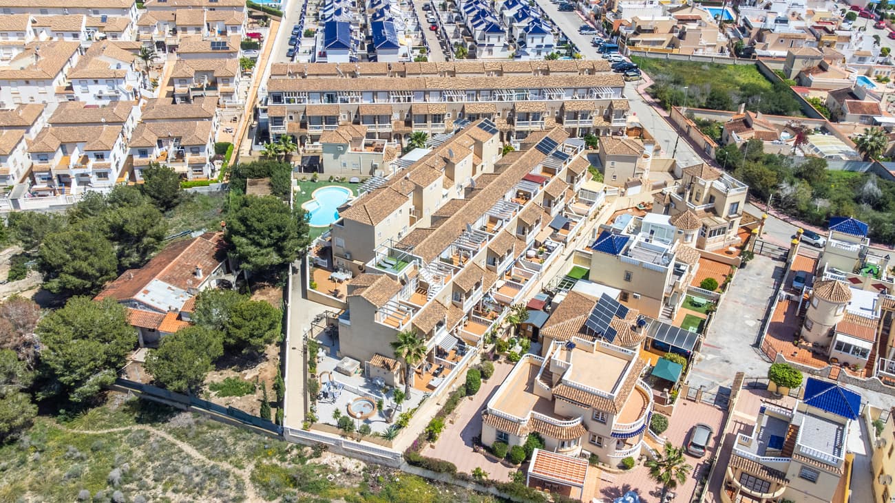 Immerse yourself in the charm of Mediterranean living with this beautifully renovated townhouse nestled in a serene community in Orihuela, Alicante. From the sun-kissed exterior to the sophisticated interior, every inch of this home is designed to delight and inspire.Boasting a generous 124 square meters of living space, this residence features four bedrooms, including a spacious primary bedroom that serves as a peaceful retreat after a long day. The home also includes two full bathrooms and a convenient half-bath, making morning routines as smooth as your Spanish espresso.The heart of this home is undoubtedly its cozy, well-appointed kitchen, where you can whip up delectable meals with ease. Flowing effortlessly from the kitchen is the living area, a perfect space for relaxing with family or entertaining friends, all while enjoying views of the community.Step outside, and you’ll find yourself in a tranquil urbanization that boasts a communal pool—ideal for cooling off on those sizzling summer days or lounging with a good book. The private garage ensures your vehicle is kept safe and sound, possibly dreaming of road trips along the stunning Costa Blanca.For those who venture outside, convenience is just a stone’s throw away. Satiate your appetite at La Luna Restaurante Bar located merely steps from your front door, or fulfill your shopping needs at nearby supermarkets like Aldi and Supermercado Consum. Families will appreciate the close proximity to IES Playa Flamenca, ensuring a short commute for the young scholars.This townhouse is a sun worshipper’s paradise, bathed in natural light throughout the day, thanks to its thoughtful orientation. Whether you're basking in the morning rays with a cup of coffee or enjoying the last light of day from your private terrace, this home ensures you experience every bit of sunshine.This property isn’t just a house, it’s a lifestyle—a sanctuary where every day feels like a vacation. Whether you’re dipping in the pool, exploring local cuisine, or simply relaxing in your elegantly designed living space, this townhouse offers a blend of comfort, convenience, and luxury that makes it not just a smart investment, but a place to call home. Don’t miss your chance to own this little slice of heaven in Alicante!