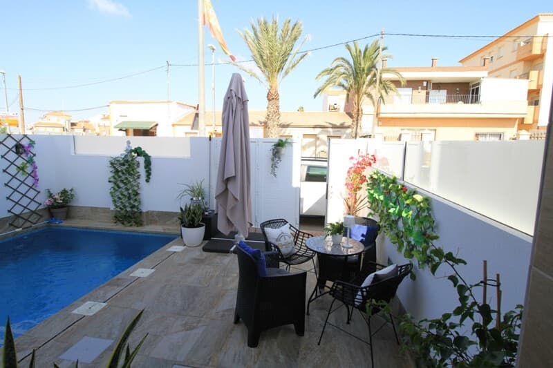 We are pleased to offer this stunning fully furnished, one year old townhouse in Avileses, very tastefully decorated. It has different terraced areas and a large solarium, allowing you to enjoy all hours of sunshine every day of the year, with a private swimming pool and the ability to park on the plot. The property enjoys 3 bedrooms and 2 bathrooms and has been designed on three levels in a contemporary style and open plan concept, comprising a fully-fitted kitchen and lounge-dining room. The build is of the highest standard and it comes equipped with: Private pool, integral air conditioning, fully fitted kitchen with all electrical appliances: ceramic hob, oven and microwave on top, extractor fan, integrated fridge/freezer, dishwasher, etc. It is also fitted with a full alarm system linked to a control room and the front gate has an access system to identify your visitor. The main board electrical rating has been upgraded, to cope with using multiple equipment at the same time, whilst an internet connection is in place.This property has been decorated beautifully and what is seen in the pictures will mostly be part of the sale. The fitted bathrooms have suspended toilets, vanity units, mirrors and rainfall shower heads. All the fitted cupboards and wardrobes with drawers are lined. The interior lighting in the kitchen, living room, hallway and bathrooms have led spotlights, separately, side lamps and other wall/ceiling fittings will remain in the property. Externally, there are integrated led spotlights at the pool area, on the first floor terrace and on the solarium. This property also benefits from being the end house and has a private gate installed at the back, to access the side foot path to the cafeteria.  The development is located in Avileses (Murcia), surrounded by all services and sports facilities, near several Golf Courses such as La Torre Golf and Hacienda Riquelme, and is a 20 minute drive to Murcia airport and a 15 minute drive to the Mar Menor and Mediterranean beaches.The remaining properties currently being built on the development, are priced higher than this amazing ready to go option!A Citroen Aircross is also available to purchase for 15,000€, as a private sale and not part of the property price.
