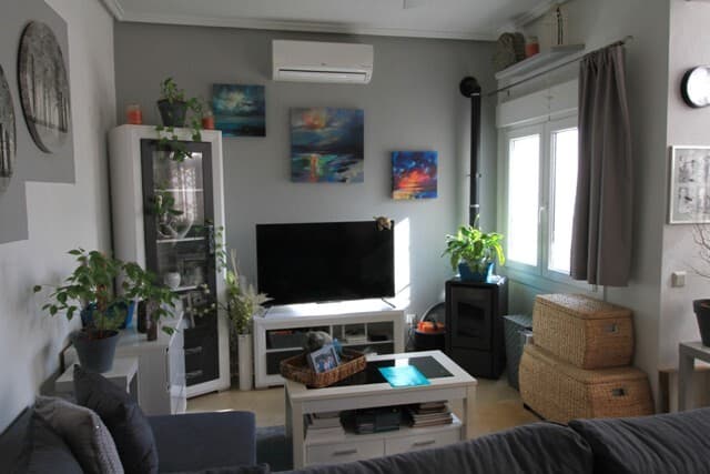 Brand new to the market, is this delightful upgraded detached villa, with a large communal pool, shared by only 20 properties, many of which are holiday homes.The villa is accessed up a long tiled drive with gates at the top. These open up onto a large fully tiled level area that can be used to sit in privacy and enjoys the sun all day, due to being south facing.Up a few steps to the left, we access the steel multi-point lock front door which opens into the large separate kitchen. White gloss upper and lower cabinets ensure plenty of storage space and in all there is 6 meters of counter space. A fan is also fitted above the preparation counter. From the kitchen, we enter a large lounge area. It is fitted with a modern ceiling fan, hot/cold air conditioning and a pellet burner. The fibre optic internet connection is located here. The back door to access the solarium comes off the lounge. The views from the solarium across the park land are amazing and again, it is in full sun all day. A storage room with PVC door is off the solarium.From the lounge, there is a small hall from which the main bathroom and both bedrooms are entered. In the main bathroom is a large shower with thermostatic control, a wash hand basin with doors under, a toilet and a wall hanging cupboard. Straight across from the lounge is the first bedroom with fitted cupboards, large enough for a double bed and side cabinets. Turning right we enter the larger of the two bedrooms. It comfortably fits a large double bed and has fitted cupboards, a ceiling fan and hot/cold air conditioning. Off here is an en-suite with a shower, wash basin with drawers under and a toilet. Both bathrooms have wall mounted heating units.The tiling in the lounge and kitchen are a neutral light sand colour, whilst the other rooms have a white tile with a light grey streaked pattern.The property has been coated in a no paint surface which also adds an extra layer of insulation. Gutters and downpipes are fitted all round. Double glazed PVC tilt and turn windows are fitted throughout, each window has modern shutters and slide up and down insect netting. At the back of the property is a store, that takes up the space under the stairs to the solarium and where the modern gas boiler is located for the hot water. Mains gas supplies the hob in the kitchen. Located close to El Recorral park and La Marquesa golf club with a supermarket, bars and restaurants just down the road. A 5 minute drive gets you to the high street or the medical center and chemist. It is only a 12 minute drive to the golden sandy blue flag beaches at Guardamar and 40 minutes to Alicante airport.