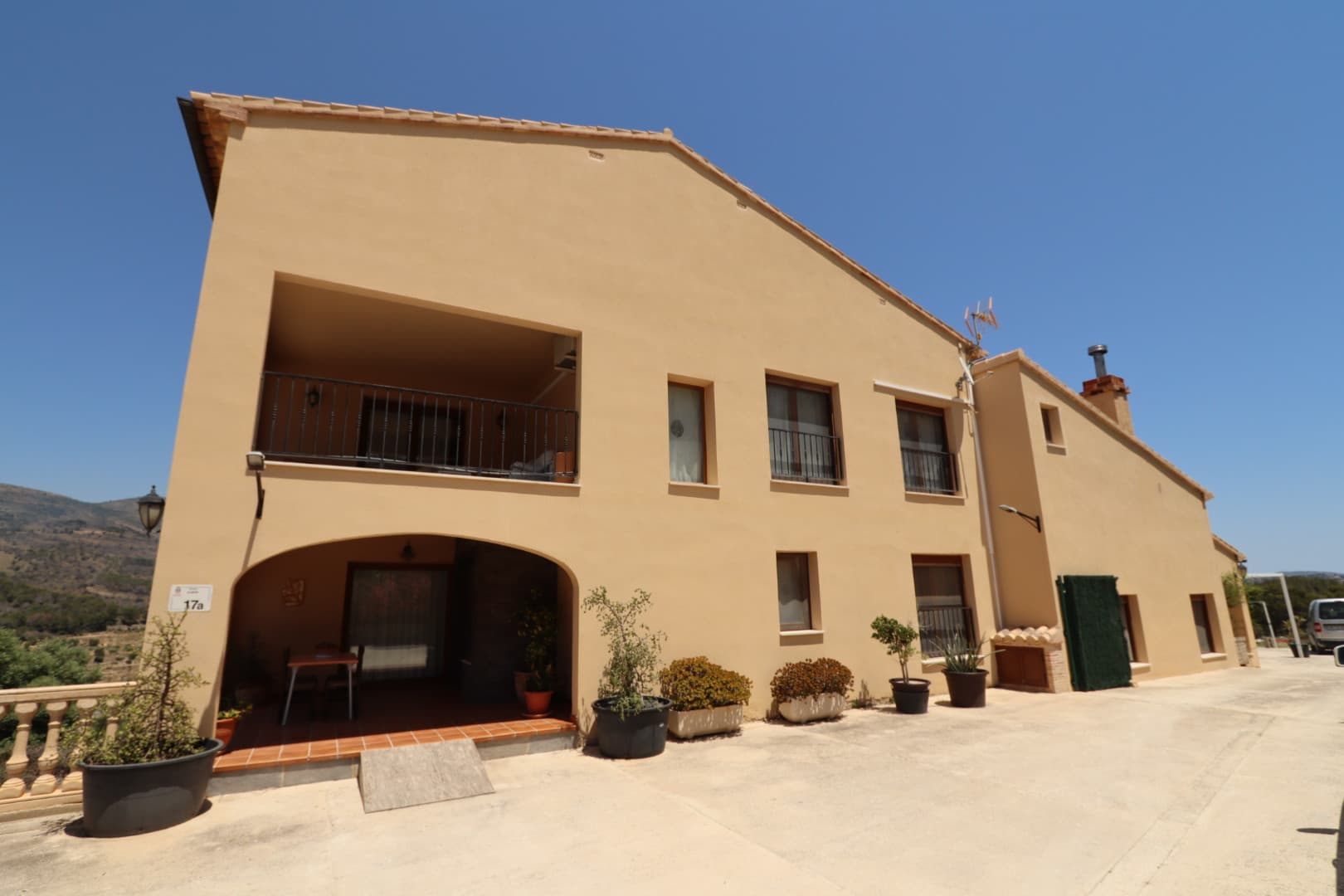 Are you looking for a property with privacy, space, sustainability, and spectacular views? This incredible rustic estate in Lleus, Benissa has it all. Located on a private plot of 13,000 m², this property offers panoramic views of the Mediterranean countryside and is strategically situated just a few minutes' drive from Moraira, Calpe, and Jávea.An exceptional property, perfect for several familiesThe estate boasts almost 500 m² built and offers up to three independent homes, making it an ideal option for large families, tourist accommodation, or co-living. In total, it can comfortably accommodate more than 20 people.Main residence:Spacious living-dining room with fireplace and equipped kitchen in traditional Spanish style.1 double bedroom and full bathroom on the ground floor.Master bedroom on the upper floor with dressing room, ensuite bathroom, and access to a large private terrace with open views.2 additional double bedrooms, 1 full bathroom, and a very spacious multipurpose room (currently accommodating 7 single beds), ideal for a home cinema, gym, or studio.Ground floor apartment:Living-kitchen-dining room, 2 bedrooms, a multipurpose room, and 1 bathroom.Independent apartment:Large covered terrace, living-dining room, equipped kitchen, 2 bedrooms, and full bathroom. Independent entrance.Outdoor spaces designed for enjoymentThe estate features a private pool surrounded by sunny terraces, outdoor kitchen, barbecue area, covered dining area with a Mediterranean style pergola, and outdoor bathroom. A perfect setting for relaxing, enjoying the outdoors, or entertaining guests.Solar energy and private water: autonomy and sustainabilityOne of the great advantages of this property is its self-sufficiency:8 kW solar installation with a 10 kW battery, allowing for efficient and sustainable energy consumption.A unique opportunity for those seeking a sustainable home in the countryside, with potential for various uses: permanent residence, vacation rental, country house, or family investment.Want more information or to schedule a visit? Contact us today.
