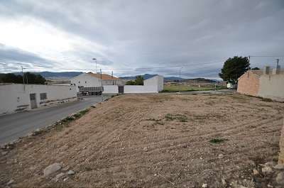 A building plot with storage in the popular village of Torre del Rico. This is a legal building plot.We are specialists in the Costa Blanca and Costa Calida specialising in the Alicante and Murcia Inland regions with a particular emphasis on Elda, Pinoso, Aspe, Elche and surrounding areas. We are an established, well known and trusted company that has built a solid reputation amongst buyers and sellers since we began trading in 2004. We offer a complete service with no hidden charges or surprises, starting with sourcing the property, right through to completion, and an unrivalled after sales service which includes property management, building services, and general help and advice to make your new house a home. With a portfolio of well over 1400 properties for sale, we are confident that we can help, so just let us know your preferred property, budget and location, and we will do the rest.