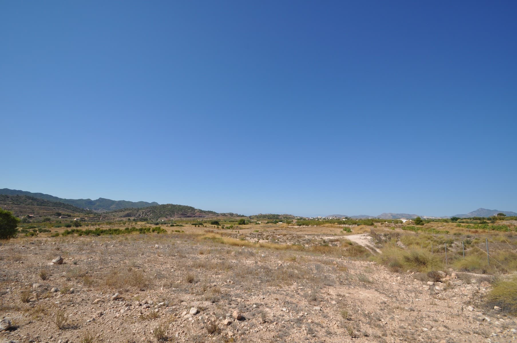 Great opportunity! Land located Macisvenda. It has beautiful clear views! Currently there is no electric, It has irrigation water. Do not miss this opportunity and contact us so that we can organize a visit. We have numerous plots in the areas.A lovely large plot of 49900m2 building plot near Macisvenda. With irrigation water but no electric Solar systems can be installed from as little as 6000 euros. Macisvenda is a lovely quiet village less than ten minutes drive into the beautiful town of Hondon de las Frailes with its beautiful bars and restaurants. Its a very international area, with people from different nationalites choosing this very traditional and picturesque area to live in. We are specialists in the Costa Blanca and Costa Calida specialising in the Alicante and Murcia Inland regions with a particular emphasis on Elda, Pinoso, Aspe, Elche and surrounding areas. We are an established, well known and trusted company that has built a solid reputation amongst buyers and sellers since we began trading in 2004. We offer a complete service with no hidden charges or surprises, starting with sourcing the property, right through to completion, and an unrivalled after sales service which includes property management, building services, and general help and advice to make your new house a home. With a portfolio of well over 1400 properties for sale, we are confident that we can help, so just let us know your preferred property, budget and location, and we will do the rest.
