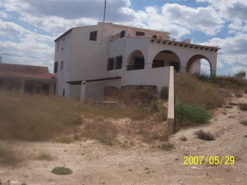 A large rustic country house with a build area of 416m2 with lovely views. Part of the property has been reformed and is liveable, whilst other parts require reformation. The property sits on a large plot of 10,000m2 and has mains electric and a water deposit. There is also a large pool (17m x 7m), BBQ area, garage, etc. a further 20,000 in deeds and in reality has 37,000 is also available at additional cost of 50000 eurosWe are specialists in the Costa Blanca and Costa Calida specialising in the Alicante and Murcia Inland regions with a particular emphasis on Elda, Pinoso, Aspe, Elche and surrounding areas. We are an established, well known and trusted company that has built a solid reputation amongst buyers and sellers since we began trading in 2004. We offer a complete service with no hidden charges or surprises, starting with sourcing the property, right through to completion, and an unrivalled after sales service which includes property management, building services, and general help and advice to make your new house a home. With a portfolio of well over 1400 properties for sale, we are confident that we can help, so just let us know your preferred property, budget and location, and we will do the rest.