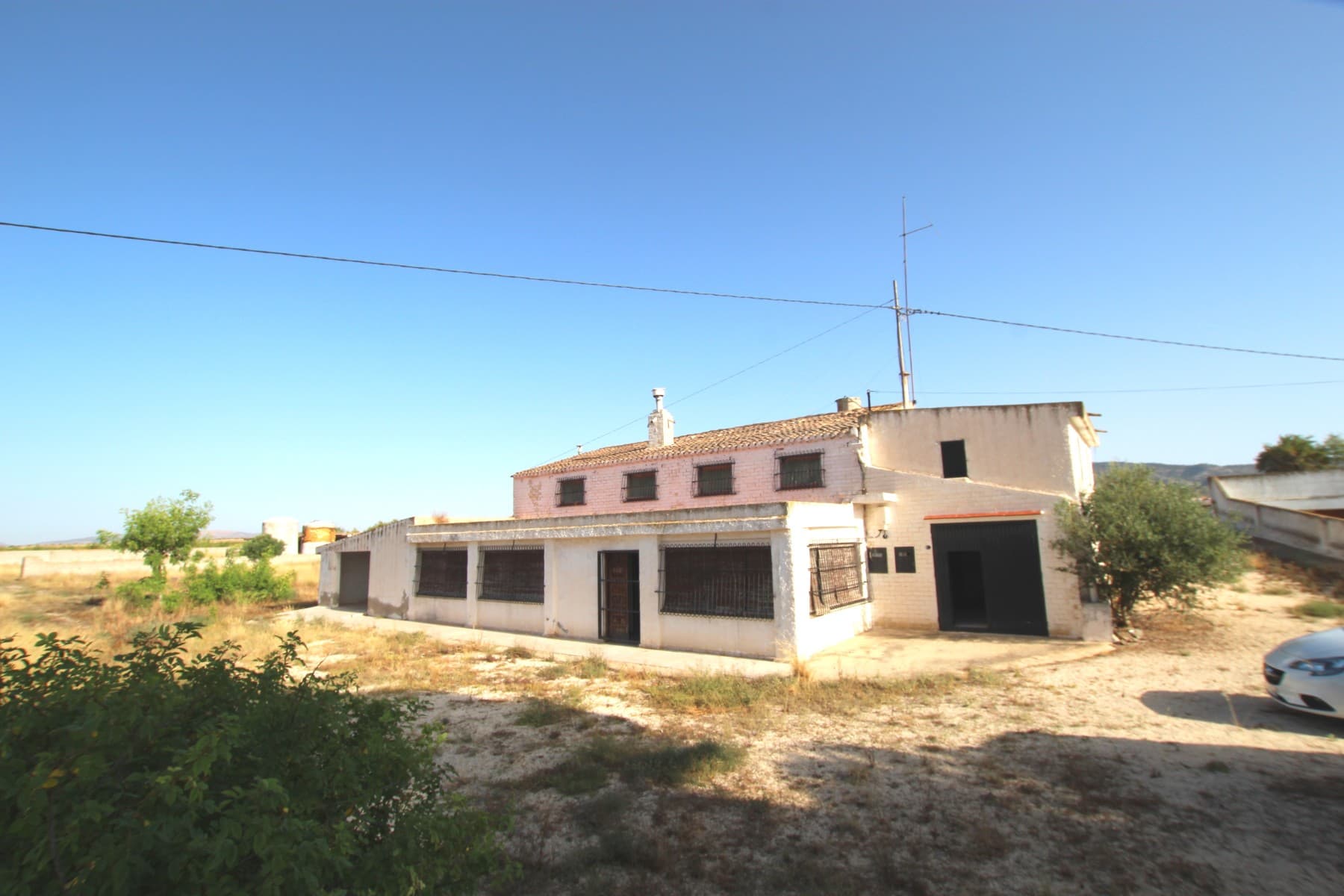 This wonderful country house, is full of interesting places.First, the plot has 40,000 m2 and has some boxes for horses, making it ideal for riding and caring for horses. It also has some fruit trees and shade, a small pine forest, and a cistern.The property built, has in total approximately 400m2. The house has two floors, the ground floor of 200m2 with living room, kitchen and toilet. The top floor has 80 m2 and has 3 bedrooms and another bathroom.The ground floor, communicates with a cave house of 100m2, this cave house has 2 bedrooms, 1 bathroom and another kitchen, so it is perfect to accommodate guests or use it as a vacation rental. The cave has 2 independent accesses to the street.On the other hand, the property has an underground cellar of 700m.The house is delivered with the furniture and electrical appliances that it has. It has barbecue, storage room, 2 garages, terrace, solarium, fireplace, security bars in the windows, so it is ready to move into.If you like this special property, please, do not hesitate to contact us to arrange a visit.We are specialists in the Costa Blanca and Costa Calida specialising in the Alicante and Murcia Inland regions with a particular emphasis on Elda, Pinoso, Aspe, Elche and surrounding areas. We are an established, well known and trusted company that has built a solid reputation amongst buyers and sellers since we began trading in 2004. We offer a complete service with no hidden charges or surprises, starting with sourcing the property, right through to completion, and an unrivalled after sales service which includes property management, building services, and general help and advice to make your new house a home. With a portfolio of well over 1400 properties for sale, we are confident that we can help, so just let us know your preferred property, budget and location, and we will do the rest.