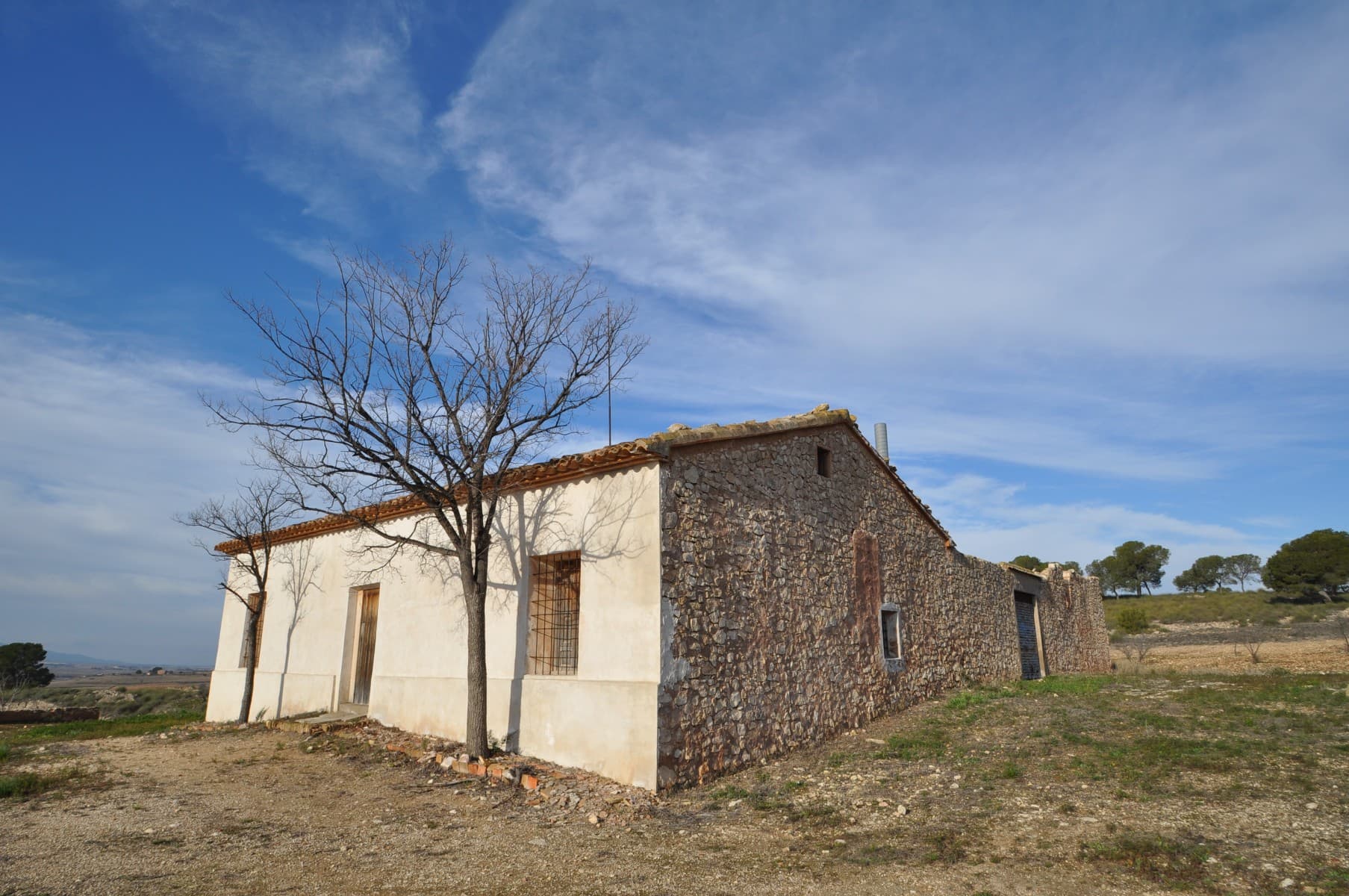 Fabulous country house located only a short distance from the Village of Torre del Rico. Set on a hill, this property offers the perfect retreat and hideaway. The property itself is huge! Currently used as a family weekend and summer home - it is in need of a good clear out and modernisation - having said that, the potential is immense! If you are looking for a traditional Spanish home which can be converted into a bed and breakfast, or some sort of health retreat, then this is an ideal property as it has and the character. It boasts a beautiful internal courtyard, separate accommodation, lovely terrace overlooking the courtyard, large patio, well established garden with almonds trees, etc. Internally, there are lots of original features such as original flooring, original doors, etc. It has not been spoilt by a modern reform and is an ideal property to put your mark on. There are neighbours around, but very far, for that the property feels very private and secluded. Great for a business opportunity also! Amazing views.We are specialists in the Costa Blanca and Costa Calida specialising in the Alicante and Murcia Inland regions with a particular emphasis on Elda, Pinoso, Aspe, Elche and surrounding areas. We are an established, well known and trusted company that has built a solid reputation amongst buyers and sellers since we began trading in 2004. We offer a complete service with no hidden charges or surprises, starting with sourcing the property, right through to completion, and an unrivalled after sales service which includes property management, building services, and general help and advice to make your new house a home. With a portfolio of well over 1400 properties for sale, we are confident that we can help, so just let us know your preferred property, budget and location, and we will do the rest.