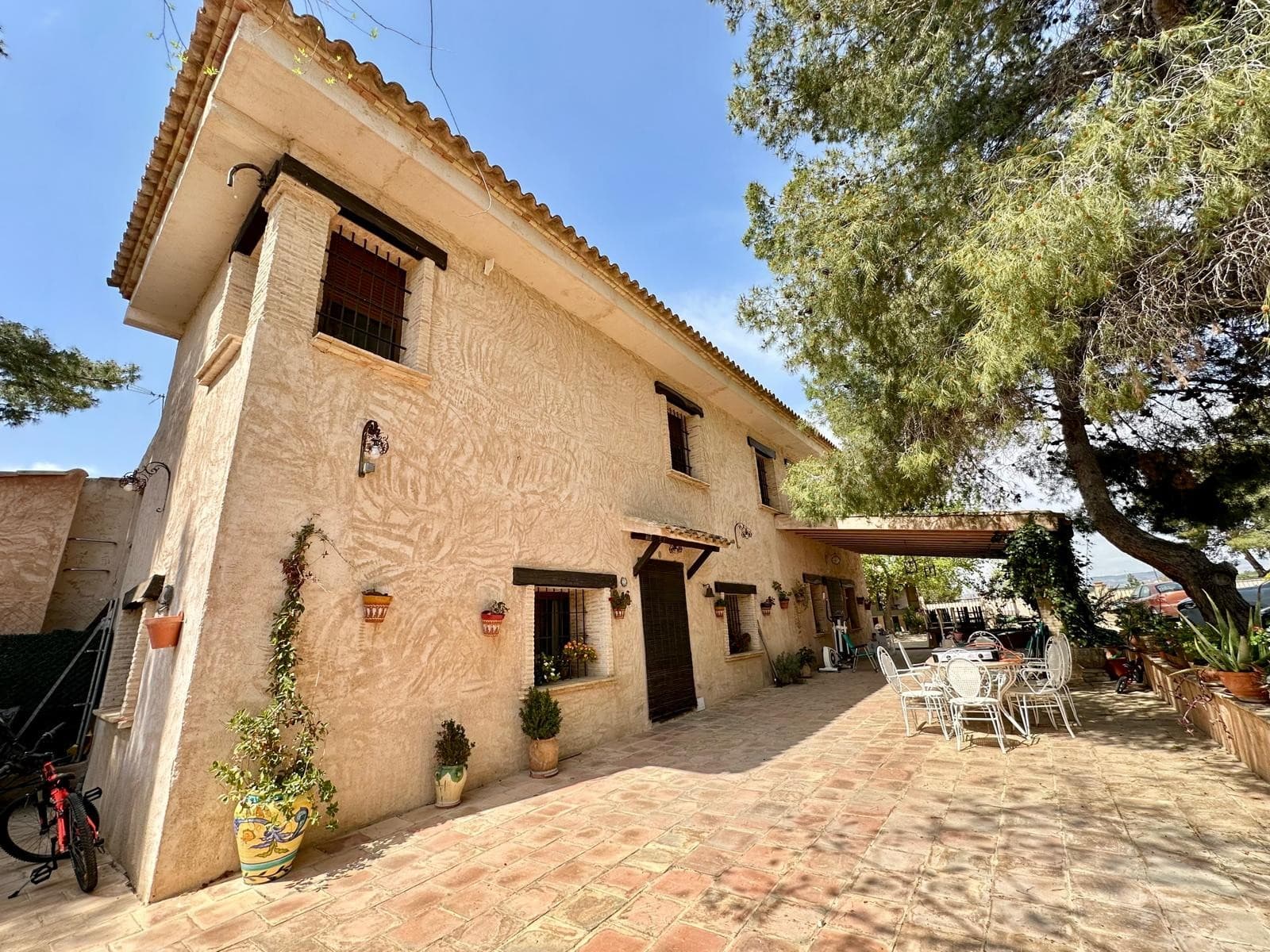 Traditional Finca with Independent Annexe, Pool & Large Plot – 5 km from YeclaThis beautifully restored traditional finca offers space, comfort, and character in a peaceful countryside setting, just 5 km from Yecla. The property consists of a main house, a fully independent annexe, a 300m² warehouse, a swimming pool with a dedicated entertainment area, and a spacious plot with landscaped gardens and stunning 360-degree views.Main HouseThe main house blends traditional charm with modern comfort. The ground floor features a spacious kitchen, a bright lounge-diner with a fireplace, a second living room with an open-plan kitchen and fireplace, a double bedroom with an en-suite, an office (or single bedroom), and a small internal patio. A staircase leads to the upper floor, which includes six double bedrooms, two family bathrooms, and a terrace housing the heating system. High ceilings and exposed wooden beams add to the rustic charm.Independent AnnexeThe separate guest house, recently renovated, is ideal for year-round living. It features a lounge/dining area with a pellet stove, a fully equipped kitchen, a large pantry/laundry room, three bedrooms, and two bathrooms. Insulated walls and an automatic pellet stove ensure comfort throughout the seasons.Outdoor Features Large swimming pool area with a covered seating space and bathroom. BBQ area with an outdoor kitchen and additional bathroom. Garage & warehouse with separate access and internal connection to the main house. Landscaped gardens, a play area, and a small pine forest. Plenty of parking space. The property is connected to electricity, mains water, and also has a private well. With its generous space and well-designed layout, it is ideal for a large family or as a potential rural tourism business.Yecla is a town located approximately one hour inland from Alicante and the airport and is built around the furniture manufacturing industry. As a result it is an affluent town which has a large population of approximately 38,000 people and as a result has a variety of shops, bars, restaurants, plenty of supermarkets to choose from and good schools. It also has the general hospital for the area as well as medical centre for normal GP appointments. Historically yet there was also very popular for its wines and as a result there are several large wine producing bodegas in and around the town which also sell to the general public - there are also some great wine tasting venues and tours available. Also historically the town of yecla has Monte Arabi which is a small mountain on the outskirts of the town and is renowned for prehistoric cave paintings dating back 10,000+ years.There are 2 daily food markets in Yecla and a weekly market on Wednesdays. Yecla also is famous for furniture manufacturing and has a huge amount of furniture shops stretching on both sides of a 2 mile long road, you are spoilt for choice, it's a rich town because of the high employment furniture industry.If you liked this property, do not hesitate to contact us to organize a visit, we will be happy to help you!We are specialists in the Costa Blanca and Costa Calida specialising in the Alicante and Murcia Inland regions with a particular emphasis on Elda, Pinoso, Aspe, Elche and surrounding areas. We are an established, well known and trusted company that has built a solid reputation amongst buyers and sellers since we began trading in 2004. We offer a complete service with no hidden charges or surprises, starting with sourcing the property, right through to completion, and an unrivalled after sales service which includes property management, building services, and general help and advice to make your new house a home. With a portfolio of well over 1400 properties for sale, we are confident that we can help, so just let us know your preferred property, budget and location, and we will do the rest.