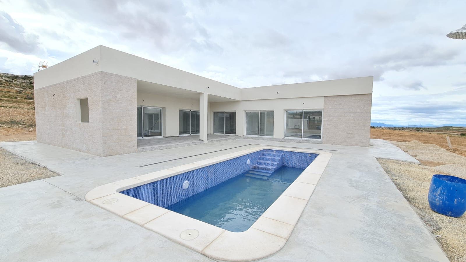 Off-Plan Villa in Torre del Rico – 3 Bedrooms, 3 BathroomsThis modern off-plan villa in Torre del Rico offers a perfect blend of contemporary design and comfort. The home features three spacious bedrooms and three bathrooms, providing ample space for a family or guests. The villa will be built with high-quality materials, including energy-efficient insulation, modern finishes, and a well-designed layout to maximize natural light.The open-plan living area connects seamlessly with the kitchen, creating a bright and inviting space. The villa will also include pre-installation for air conditioning, a private terrace, and a low-maintenance outdoor area, ideal for enjoying the region's sunny climate.Please Note: The price INCLUDES the plot with water and electric, all planning permissions and licenses. Location – Torre del RicoTorre del Rico is a peaceful village known for its stunning natural surroundings and relaxed lifestyle. Located within easy reach of Pinoso and Yecla, the area offers a mix of rural charm and modern conveniences. It is an excellent location for those looking to escape city life while still being close to essential amenities, local markets, and traditional Spanish restaurants. The region is also popular for outdoor activities, including hiking, cycling, and wine tasting at nearby vineyards.Payment PlanThe payment structure for the villa is as follows: €6,000 reservation. €40,000 purchase of land. At the same time, a check for €30,000 will be issued at the notary's office for licenses and project fees. €60,000 upon obtaining the license for land preparation, foundation, and structure. €60,000 for roofing and exterior enclosures. €60,000 for interior partitions, pre-installation of electricity and plumbing. €60,000 for flooring, tiling, and the pool. €15,000 for trades, exterior and interior carpentry, finishing works, and painting. €6,000 for final client inspection. After the final payment, the buyer will receive a project report approved by the College of Architects, along with the water and electricity certificates.We have a large portfolio of properties in the Costa Blanca and Costa Calida areas, specialising in country properties, villas, fincas, building plots and design and build options in the Alicante and Murcia regions with a particular emphasis on Elda, Monovar, Pinoso, Sax, Villena, Aspe, Fortuna, Albacete and many more surrounding areas. We have been established since 2004 and have decades of experience between the team which we bring to bear to help you find and secure your new dream home. We help you every step of the way to make sure your purchase in Spain is safe and hassle free. We are not here to sell you a property, we are here to help you realise your dream and find what is right for you. With us you are in the safest hands. Contact us now to have a no obligation chat about how you too can realise your dreams.