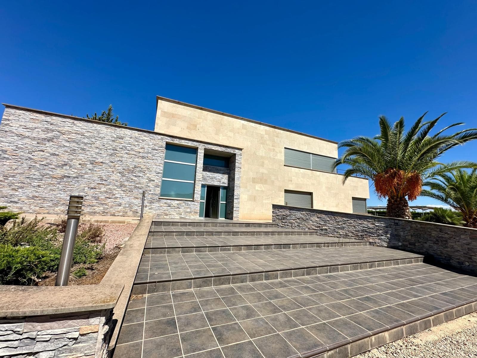Introducing a luxurious modern property that offers you a lifestyle of comfort, convenience, and elegance. Boasting 5 spacious bedrooms and 8 elegant bathrooms, this home is ideal for families who appreciate style and luxury.The house features a fully equipped gym, perfect for fitness enthusiasts, and a relaxing Jacuzzi to unwind after a long day. For tennis lovers, the property comes with its own private tennis court.The open-plan kitchen with a breakfast bar is perfect for casual dining and entertaining guests. The house is designed to maximize natural daylight throughout, creating a bright and welcoming ambiance.Step outside and you will be greeted by a beautifully landscaped garden, filled with mature trees and a little play area for children. The pool is surrounded by a tiled terrace, perfect for lounging and enjoying the stunning views from both the pool and upstairs terrace.The house is fully furnished with stylish modern furniture, which is included in the price. The property is located inland, just outside Yecla, a town with a variety of amenities such as schools, medical centres, bars, restaurants, shops, and a Sunday market. The airport is less than an hour away, as are the beaches, making this property an ideal location for those who want the best of both worlds.This luxurious modern property is truly a dream home, offering everything you need for a comfortable, luxurious lifestyle. To schedule a viewing or for more information, please contact us.Yecla is a town located approximately one hour inland from Alicante and the airport and is built around the furniture manufacturing industry. As a result it is an affluent town which has a large population of approximately 38,000 people and as a result has a variety of shops, bars, restaurants, plenty of supermarkets to choose from and good schools. It also has the general hospital for the area as well as medical centre for normal GP appointments. Historically yet there was also very popular for its wines and as a result there are several large wine producing bodegas in and around the town which also sell to the general public - there are also some great wine tasting venues and tours available. Also historically the town of yecla has Monte Arabi which is a small mountain on the outskirts of the town and is renowned for prehistoric cave paintings dating back 10,000+ years.There are 2 daily food markets in Yecla and a weekly market on Wednesdays. Yecla also is famous for furniture manufacturing and has a huge amount of furniture shops stretching on both sides of a 2 mile long road, you are spoilt for choice, it's a rich town because of the high employment furniture industry.We are specialists in the Costa Blanca and Costa Calida specialising in the Alicante and Murcia Inland regions with a particular emphasis on Elda, Pinoso, Aspe, Elche and surrounding areas. We are an established, well known and trusted company that has built a solid reputation amongst buyers and sellers since we began trading in 2004. We offer a complete service with no hidden charges or surprises, starting with sourcing the property, right through to completion, and an unrivalled after sales service which includes property management, building services, and general help and advice to make your new house a home. With a portfolio of well over 1400 properties for sale, we are confident that we can help, so just let us know your preferred property, budget and location, and we will do the rest.