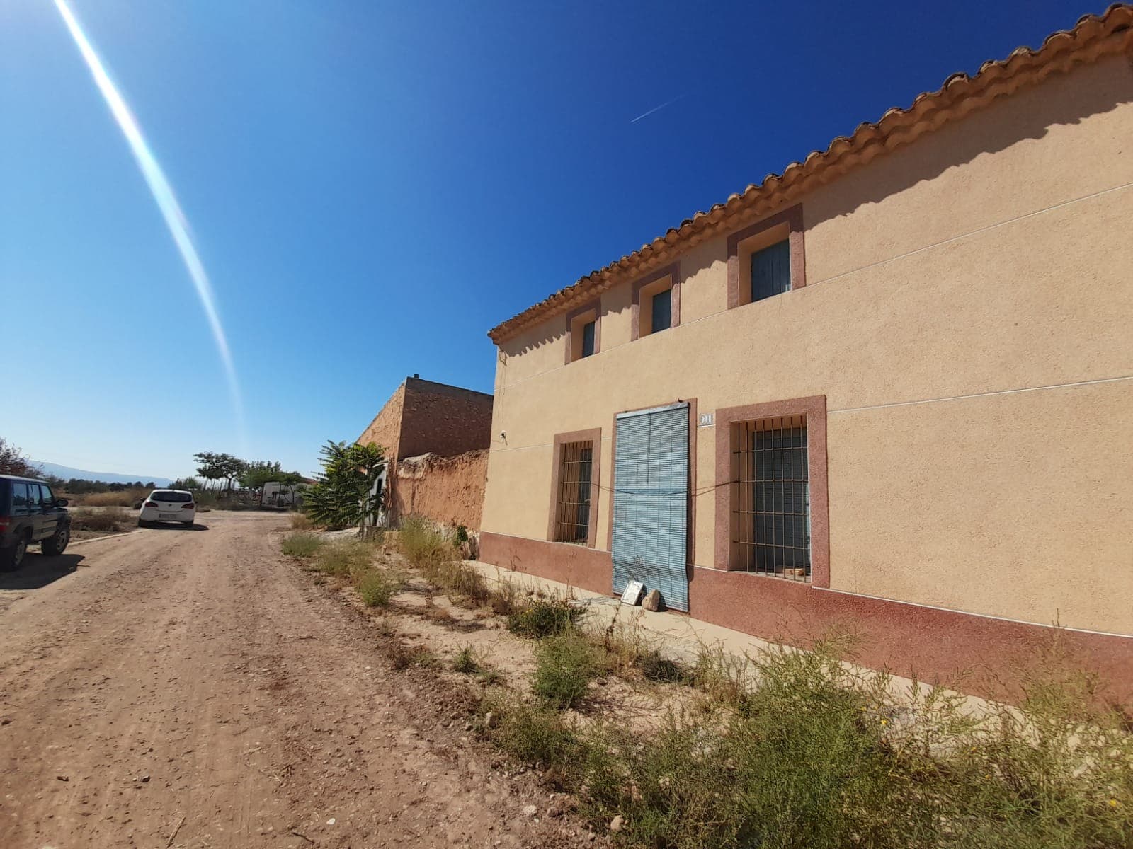 This property is located on the border between Pinoso and Jumilla, it belongs to Jumilla and therefore to the Murcia region, but it is actually closer to Pinoso. The property consists of a large old country house, spread over two floors. This house needs reform to modernize it, but due to its large surface it has many possibilities. It currently has a living room with fireplace, 3 bedrooms, a bathroom, kitchen and patio, and on the upper floor it has a large open space. Apart from the property there is a huge garage of almost 140 square meters.In front of the property there is a piece of land included in the price of 1,300 square meters.There is also the possibility of buying more land if you need it.Note: PLease note that between the main house and the garage there is a piece of land that does not belong to this property.We are specialists in the Costa Blanca and Costa Calida specialising in the Alicante and Murcia Inland regions with a particular emphasis on Elda, Pinoso, Aspe, Elche and surrounding areas. We are an established, well known and trusted company that has built a solid reputation amongst buyers and sellers since we began trading in 2004. We offer a complete service with no hidden charges or surprises, starting with sourcing the property, right through to completion, and an unrivalled after sales service which includes property management, building services, and general help and advice to make your new house a home. With a portfolio of well over 1400 properties for sale, we are confident that we can help, so just let us know your preferred property, budget and location, and we will do the rest.