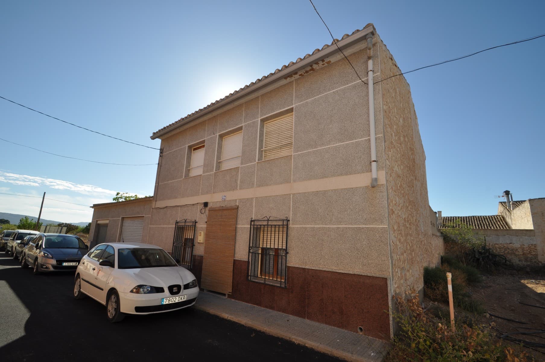 Welcome to this stunning country house located in a picturesque small hamlet, just a stone's throw away from the vibrant town of Pinoso. This beautiful property offers the perfect combination of modern amenities and traditional charm, making it an ideal home for those seeking a peaceful and comfortable lifestyle.With 5 generously sized bedrooms and 2 bathrooms, this spacious property has a total build area of approximately 211 metres squared and sits on a plot of 290 metres squared. The house is fully connected to mains electric and water, and you'll also have access to high-speed internet and telephone connections, allowing you to stay connected with the world around you.One of the standout features of this property is its great access via a tarmac Rd, making it easy to get in and out of town. Additionally, the property is just a short walk away from bars and restaurants, making it the perfect location for those who enjoy dining out and socializing.Another great benefit of living in this hamlet is the regular deliveries of fresh produce to your doorstep. You can enjoy locally grown fruits, vegetables, meat, and bread without ever leaving your home.The property also boasts three large garages, which are perfect for storage or conversion into additional living space. This means that you'll have plenty of room for all your belongings and can even add more living space to the house if needed.Overall, this country house is full of character and offers the perfect combination of peaceful living with all the amenities you need. Don't miss this fantastic opportunity to make this beautiful property your dream home!We have a large portfolio of properties in the Costa Blanca and Costa Calida areas, specialising in country properties, villas, fincas, building plots and design and build options in the Alicante and Murcia regions with a particular emphasis on Elda, Monovar, Pinoso, Sax, Villena, Aspe, Fortuna, Albacete and many more surrounding areas. We have been established since 2004 and have decades of experience between the team which we bring to bear to help you find and secure your new dream home. We help you every step of the way to make sure your purchase in Spain is safe and hassle free. We are not here to sell you a property, we are here to help you realise your dream and find what is right for you. With us you are in the safest hands. Contact us now to have a no obligation chat about how you too can realise your dreams.