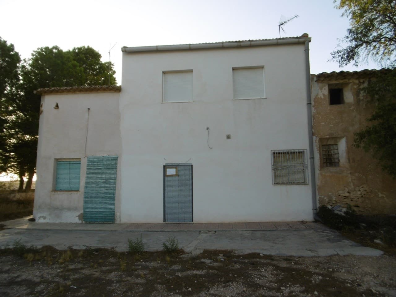 This semi-detached country house, with a total built area of 80 m² over two floors, is located 12 km from Yecla in a peaceful, natural setting. The property includes 3 bedrooms, 1 bathroom, and an open-plan living room with kitchen. Outside, there is a barbecue area and a large independent garage with space for two cars, which can also serve as a storage area or meeting room and includes a toilet. The property is equipped with access to irrigation and action water but is not connected to the electricity grid, offering a perfect opportunity for off-grid living.The Area: Yecla, in the Murcia region, is known for its rich history, vineyards, and outdoor activities. The town offers a good range of amenities, including shops, restaurants, and cultural attractions, while the surrounding countryside is ideal for those seeking tranquility and a connection to nature. This property's location provides a peaceful retreat while still being accessible to the town and its services.We have a large portfolio of properties in the Costa Blanca and Costa Calida areas, specialising in country properties, villas, fincas, building plots and design and build options in the Alicante and Murcia regions with a particular emphasis on Elda, Monovar, Pinoso, Sax, Villena, Aspe, Fortuna, Albacete and many more surrounding areas. We have been established since 2004 and have decades of experience between the team which we bring to bear to help you find and secure your new dream home. We help you every step of the way to make sure your purchase in Spain is safe and hassle free. We are not here to sell you a property, we are here to help you realise your dream and find what is right for you. With us you are in the safest hands. Contact us now to have a no obligation chat about how you too can realise your dreams.