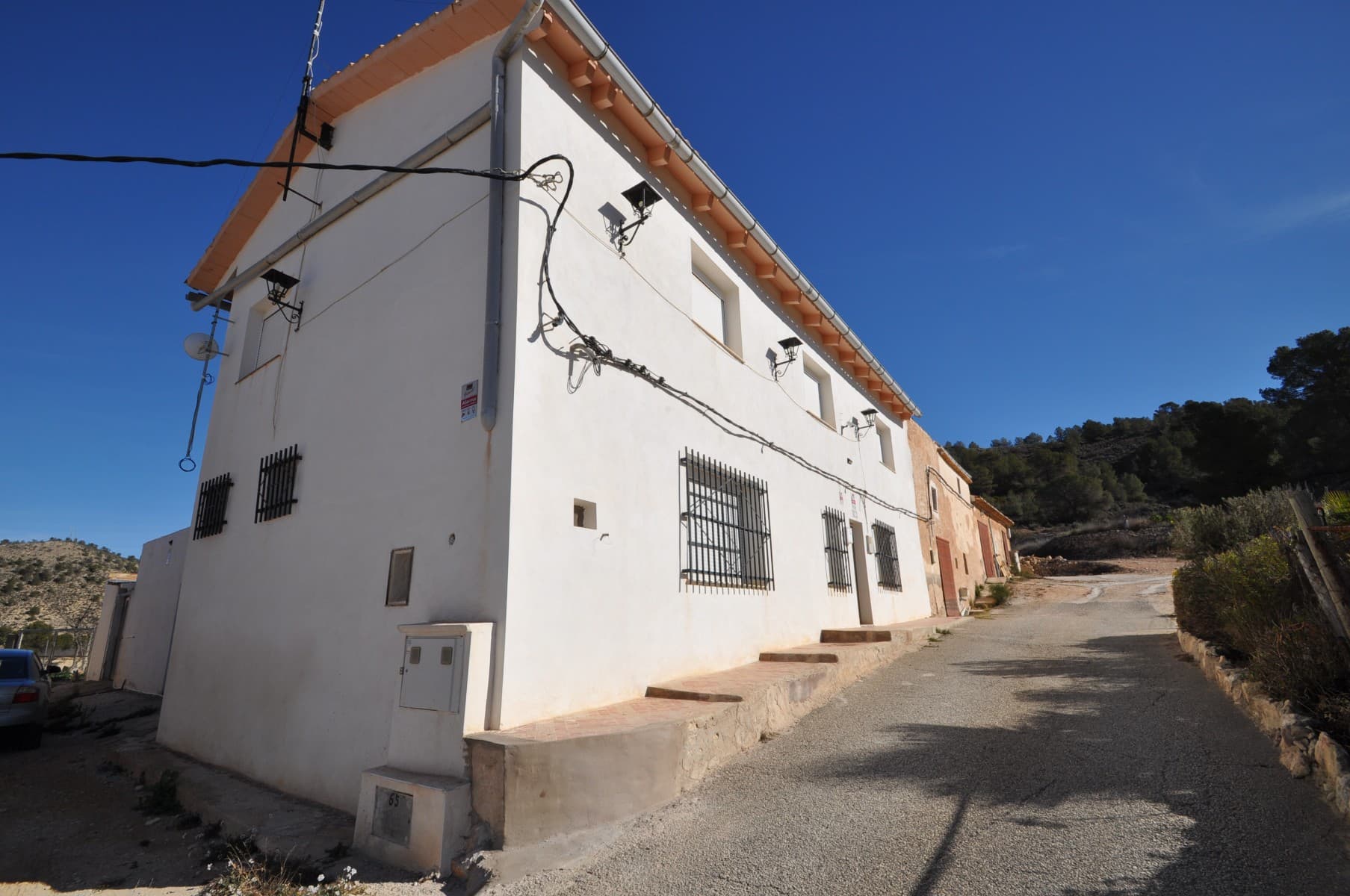 This charming country house offers a unique opportunity to enjoy peaceful living in a beautiful mountain setting. Situated on a generous 12,206m² plot, the property is bright, well-maintained, and ready to move in.Designed for flexibility, the house has two floors prepared to function as independent homes with independent entrances, making it ideal for extended families, rental opportunities, or guest accommodations. The spacious interior features antique furniture and classic décor, adding character and warmth. The property has also a small winery.Outside, you'll find a large patio with a barbecue area and jacuzzi—perfect for entertaining. The private swimming pool offers a great place to relax, while the garage provides secure parking and storage. The home is designed with adjustable reflective windows that allow natural light in while maintaining privacy and reducing heat.Located in a quiet and scenic area, the property is easily accessible and just a short drive from Monóvar and La Romana. With incredible views and a serene atmosphere, this home offers great potential for customization to suit your needs.The House is semi-detached.  Don't miss this opportunity to own a versatile and spacious home in a truly beautiful location!If you liked this property, do not hesitate to contact us to organize a visit, we will be happy to help you!