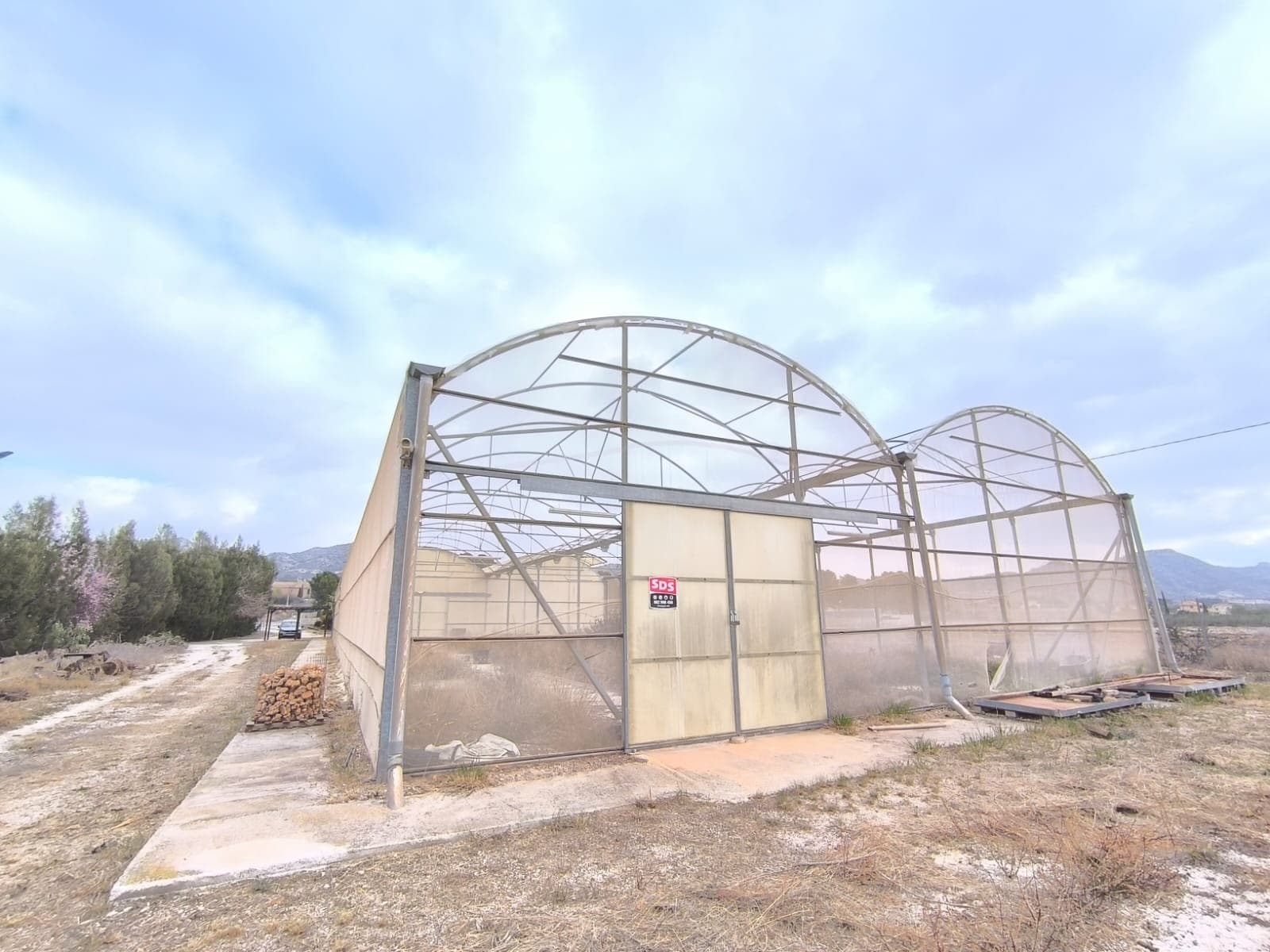 Garden Centre Near Aspe Via Stratus International SpainUnlock the potential of a thriving business opportunity in the picturesque rural area of Aspe! This former garden centre, strategically located along a busy road, boasts total parcel area of 12,100 m². On it, you can find two greenhouses measuring 450 m² each, one covered, other not, suited for cultivating plants or to be transformed for other purposes, as well as office building of 72 m², with an office, toilet, warehouse, little kitchen, and is ready for bathroom construction to accommodate your operational needs.The property is equipped with essential amenities such as irrigation water and electricity connection that accommodates both 1-phase and 3-phase systems. Moreover, a substantial water reservoir adds to the convenience and viability for agricultural or commercial use.Whether you're looking to re-establish it as a garden centre or explore new ventures, this versatile space offers tremendous possibilities for growth. Don't miss out on this exceptional opportunity to invest in your future today!We have a large portfolio of properties in the Costa Blanca and Costa Calida areas, specialising in country properties, villas, fincas, building plots and design and build options in the Alicante and Murcia regions with a particular emphasis on Elda, Monovar, Pinoso, Sax, Villena, Aspe, Fortuna, Albacete and many more surrounding areas. We have been established since 2004 and have decades of experience between the team which we bring to bear to help you find and secure your new dream home. We help you every step of the way to make sure your purchase in Spain is safe and hassle free. We are not here to sell you a property, we are here to help you realise your dream and find what is right for you. With us you are in the safest hands. Contact us now to have a no obligation chat about how you too can realise your dreams.