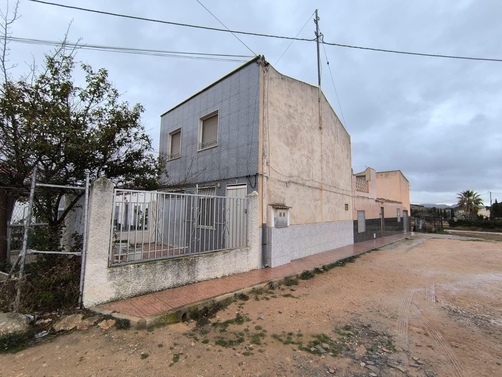 Ready to move in, spacious townhouse in Yecla. Located in a calm and safe area of Yecla, close to various amenities, walking distance from shops, bars, clinics, and the town centre. The property spans 310 m² over two floors, consisting of two apartments, making it an ideal option for a large family or two-generational living. The house is well-kept and in good condition, fully legalized.Each apartment features its own drinking water supply and mains electricity point, a private entrance, three bedrooms, a kitchen, and a bathroom, providing ample space for comfortable living. Additional features of the house include a cosy salons heated by a chimney, a balcony for outdoor relaxation, and spacious storage rooms. The property also boasts a fenced courtyard with patio, and backyard, enhancing privacy and outdoor enjoyment.This townhouse offers an economical and comfortable living solution, perfect for those seeking a spacious home with comforts of a town.About the area: Yecla is renowned for its wine production, historical landmarks, and vibrant local culture. The surrounding natural landscapes provide opportunities for outdoor activities, while the town itself offers all necessary services, including schools, shops, and restaurants. This property combines the tranquility of countryside living with easy access to modern amenities.About us: We have a large portfolio of properties in the Costa Blanca and Costa Calida areas, specialising in country properties, villas, fincas, building plots and design and build options in the Alicante and Murcia regions with a particular emphasis on Elda, Monovar, Pinoso, Sax, Villena, Aspe, Fortuna, Albacete and many more surrounding areas. We have been established since 2004 and have decades of experience between the team which we bring to bear to help you find and secure your new dream home. We help you every step of the way to make sure your purchase in Spain is safe and hassle free. We are not here to sell you a property, we are here to help you realise your dream and find what is right for you. With us you are in the safest hands. Contact us now to have a no obligation chat about how you too can realise your dreams.