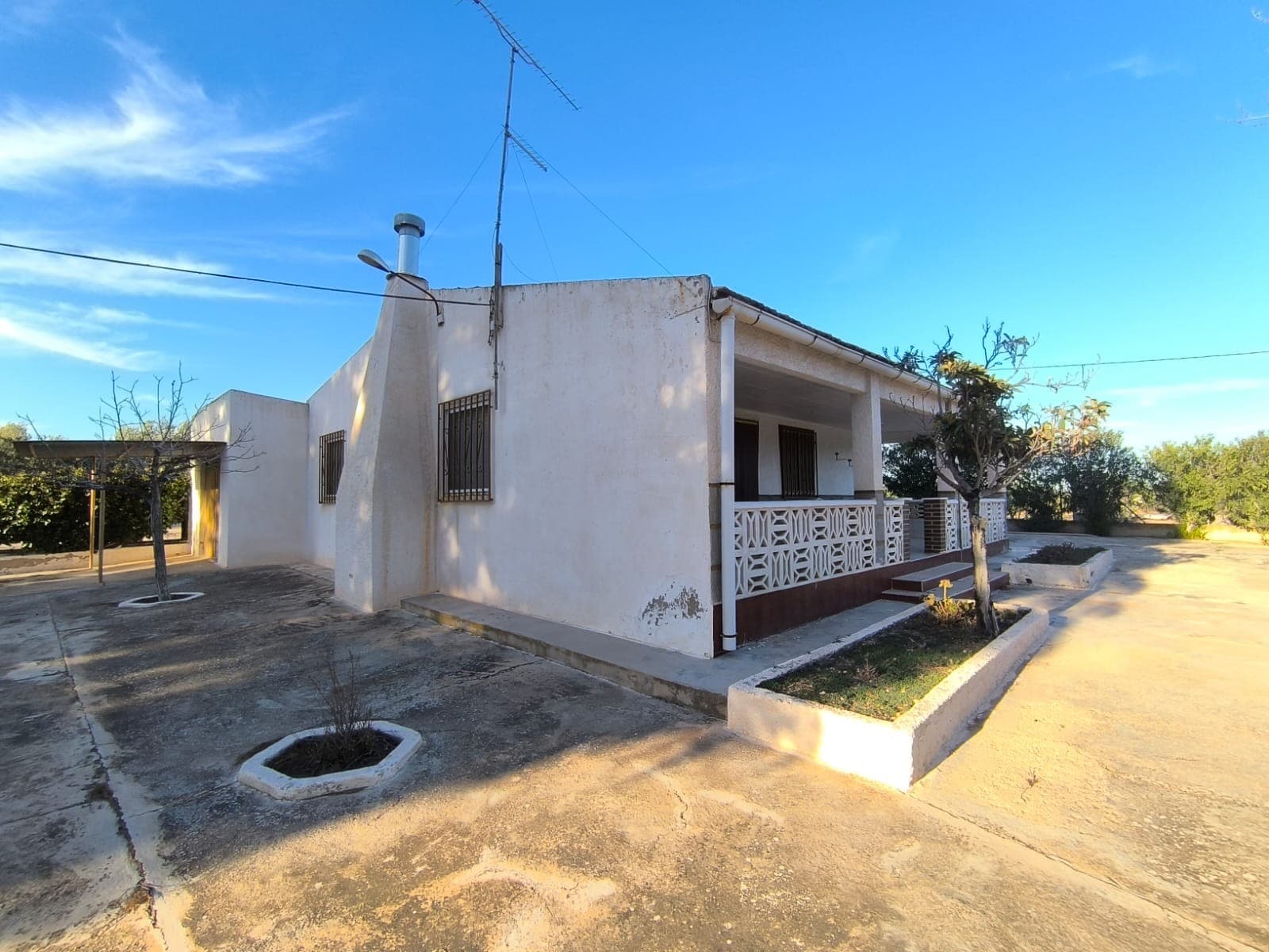 For Sale: Discover this delightful villa located in a serene rural neighborhood south of Yecla, offering easy access via tarmac road. Enjoy breathtaking mountain views from the comfort of your new home. This property is in good condition and ready to move in. An old interior presents an opportunity for renovation in your own style. The house boasts 255 m2 of space, including 3 spacious bedrooms, a bathroom, a kitchen, and multiple storage spaces. Additionally, it includes a large garage. The house boasts a total of 3 chimneys. The villa is sold fully furnished and is equipped with mains electricity and two types of irrigation water.Outside you find a beautiful fenced garden, shaded with mature pines, a large fenced swimming pool with a BBQ area, a storage building with a dog pen, a lawn, a carport, and a playground. The property also features an irrigated olive orchard of approximately 2500 m², offering a possibility of own olive oil production. This stunning location offers a perfect blend of tranquility and accessibility, making it an ideal retreat.About the area: Yecla is renowned for its wine production, historical landmarks, and vibrant local culture. The surrounding natural landscapes provide opportunities for outdoor activities, while the town itself offers all necessary services, including schools, shops, and restaurants. This property combines the tranquility of countryside living with easy access to modern amenities.About us: We have a large portfolio of properties in the Costa Blanca and Costa Calida areas, specialising in country properties, villas, fincas, building plots and design and build options in the Alicante and Murcia regions with a particular emphasis on Elda, Monovar, Pinoso, Sax, Villena, Aspe, Fortuna, Albacete and many more surrounding areas. We have been established since 2004 and have decades of experience between the team which we bring to bear to help you find and secure your new dream home. We help you every step of the way to make sure your purchase in Spain is safe and hassle free. We are not here to sell you a property, we are here to help you realise your dream and find what is right for you. With us you are in the safest hands. Contact us now to have a no obligation chat about how you too can realise your dreams.