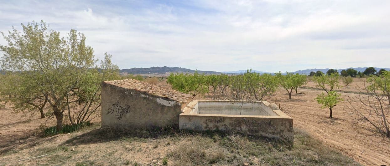Plot with Almond Trees and Natural Spring – Near Yecla and CaudeteThis 1,750 m² plot offers a peaceful countryside setting with almond trees and the added benefit of a natural spring located on the land. The property is ideal for those looking for a quiet, natural space to park a caravan, motorhome, or trailer. The land is currently unfenced but is easily accessible via paved roads leading directly to the property.Thanks to its irrigation water supply from the on-site spring, this plot is also well-suited for small-scale farming or as a weekend retreat. With wide, open views of the surrounding landscape, it provides a calm and scenic environment for outdoor enthusiasts or those simply looking to disconnect.About the AreaLocated just 12 km from Yecla and 8 km from Caudete, this plot sits in a quiet rural area with a strong agricultural tradition and panoramic views. Both towns offer all necessary services, including supermarkets, healthcare, restaurants, and schools. The area is known for its wine, almonds, and natural surroundings, making it ideal for those seeking a slower-paced lifestyle while remaining within easy reach of urban amenities.We have a large portfolio of properties in the Costa Blanca and Costa Calida areas, specialising in country properties, villas, fincas, building plots and design and build options in the Alicante and Murcia regions with a particular emphasis on Elda, Monovar, Pinoso, Sax, Villena, Aspe, Fortuna, Albacete and many more surrounding areas. We have been established since 2004 and have decades of experience between the team which we bring to bear to help you find and secure your new dream home. We help you every step of the way to make sure your purchase in Spain is safe and hassle free. We are not here to sell you a property, we are here to help you realise your dream and find what is right for you. With us you are in the safest hands. Contact us now to have a no obligation chat about how you too can realise your dreams.