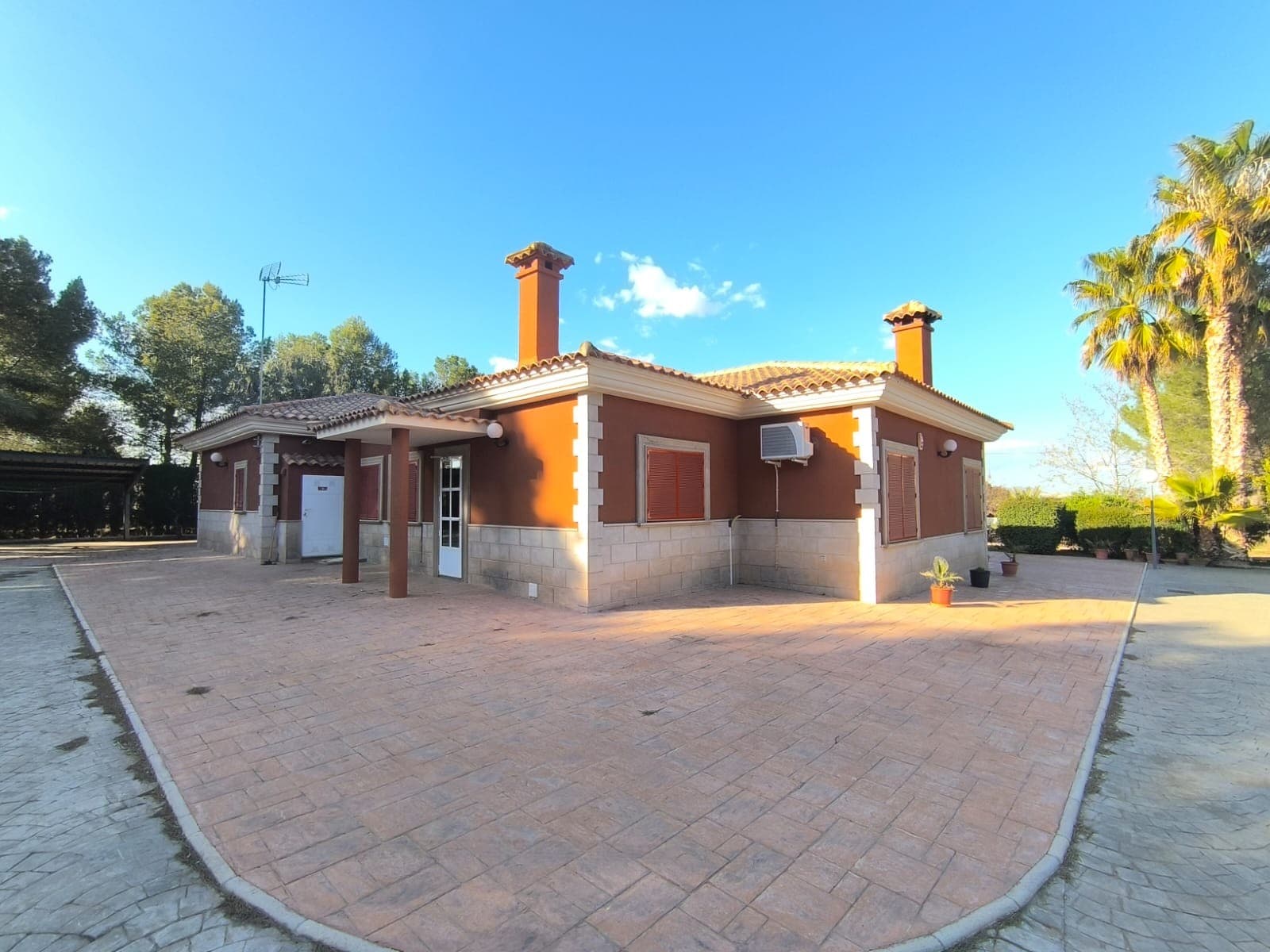 Discover this beautiful villa located in a serene neighbourhood, just 4 km from Yecla town, where you can enjoy easy access to shops, schools, and bars. This exceptional property comprises two modern houses constructed with high-quality materials, offering both comfort and style.Main Villa (built in 2002) features:5 Bedrooms2 BathroomsA cosy salon complete with a chimneyA contemporary kitchenA large solariumAmple storage roomsFully furnished and stylishly designed interiorsThermal insulation for energy efficiency & gas central heating and air-conditioning for year-round comfortSecond House (Built in 2015) includes:A generous garage equipped with three electric doors, serving as a gymA guest annex featuring a wheelchair-accessible bathroomOutdoor Features - The exterior of the property is beautifully shaded by mature trees and includes:A covered pool measuring 10 x 4 meters, complete with a filtration system, ideal for relaxation or entertainingA well-maintained garden spanning 5600 m², perfect for leisure or plant cultivationA covered carportA spacious patioAdditional Conveniences include:A wastewater cleaning system that supports tree irrigationMains irrigation water and a drinking water tankBoth grid electricity and a 2 kW solar panel systemAn alarm system connected to the police station for added securityThis beautiful, modern, and stylish house is ready to move in. Don't miss this opportunity to enjoy a luxurious lifestyle for a friendly price!About the area: Yecla is renowned for its wine production, historical landmarks, and vibrant local culture. The surrounding natural landscapes provide opportunities for outdoor activities, while the town itself offers all necessary services, including schools, shops, and restaurants. This property combines the tranquility of countryside living with easy access to modern amenities.About us: We have a large portfolio of properties in the Costa Blanca and Costa Calida areas, specialising in country properties, villas, fincas, building plots and design and build options in the Alicante and Murcia regions with a particular emphasis on Elda, Monovar, Pinoso, Sax, Villena, Aspe, Fortuna, Albacete and many more surrounding areas. We have been established since 2004 and have decades of experience between the team which we bring to bear to help you find and secure your new dream home. We help you every step of the way to make sure your purchase in Spain is safe and hassle free. We are not here to sell you a property, we are here to help you realise your dream and find what is right for you. With us you are in the safest hands. Contact us now to have a no obligation chat about how you too can realise your dreams.