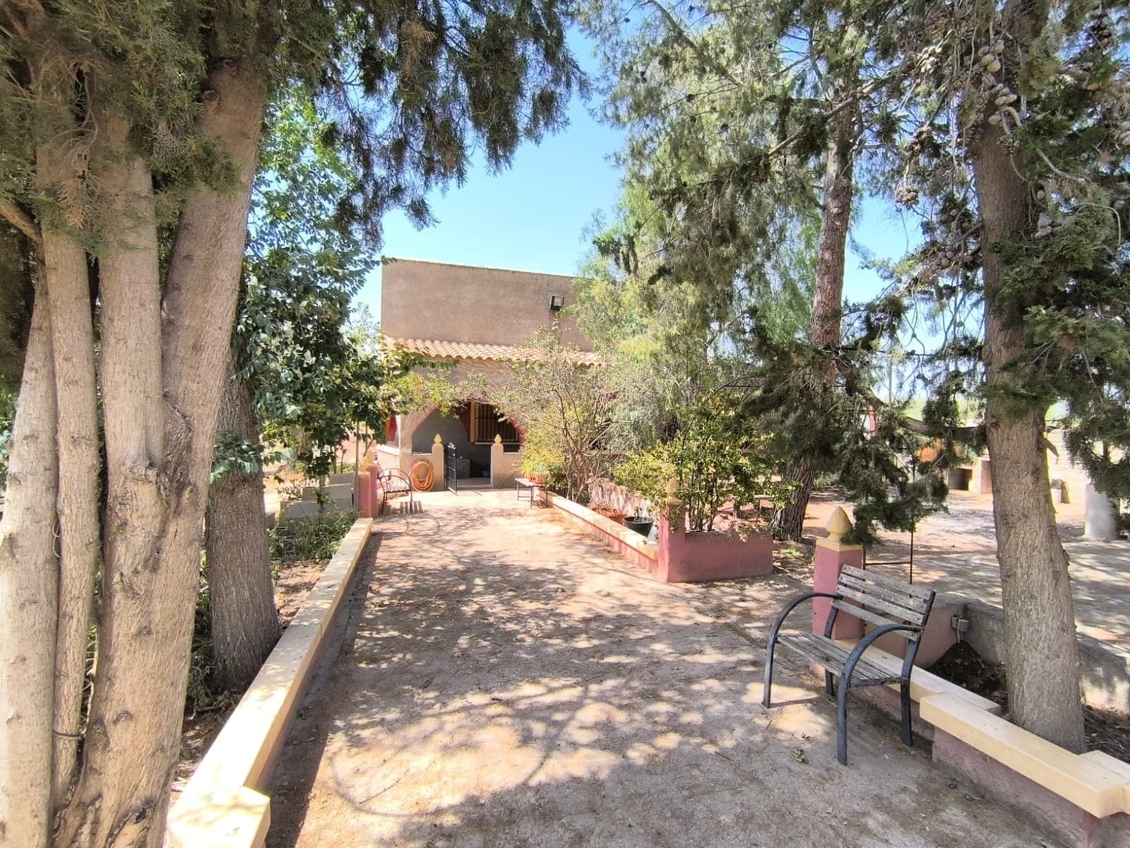 Spacious villa of 283 m² with two floors set in the centre of a 7,096 m² fenced plot in walking distance from amenities of Jumilla town. The first floor is ready to move in, it features stylish salon with a fireplace and a bar, 3 bedrooms and a bathroom to finish. The second floor is a renovation project to finish, it could offer another 2 bedrooms with a separate entrance, which needs to be added. The plot is planted with irrigated olive trees, providing a nice landscape and an agriculture production. The property also features a garage and various outbuildings for storage. The covered porch and the courtyard offer cosy shaded resting area.Due to its size and proximity to the town, yet quiet location with stunning views on the Jumilla castle, the plot could be used for touristic ventures. The villa is connected to mains electricity and has access to irrigation water. The access is via comfortable tarmac road.About the area: Jumilla is a charming town renowned for its scenic vineyards, and vibrant local culture. Known primarily for its award-winning wines, this picturesque town offers a perfect blend of traditional Spanish character and modern living. With its historic landmarks, bustling market squares, and beautiful countryside, Jumilla provides an ideal setting for those seeking a peaceful yet vibrant lifestyle in province Murcia, 80 minutes from Costa Blanca.About us: We have a large portfolio of properties in the Costa Blanca and Costa Calida areas, specialising in country properties, villas, fincas, building plots and design and build options in the Alicante and Murcia regions with a particular emphasis on Elda, Monovar, Pinoso, Sax, Villena, Aspe, Fortuna, Albacete and many more surrounding areas. We have been established since 2004 and have decades of experience between the team which we bring to bear to help you find and secure your new dream home. We help you every step of the way to make sure your purchase in Spain is safe and hassle free. We are not here to sell you a property, we are here to help you realise your dream and find what is right for you. With us you are in the safest hands. Contact us now to have a no obligation chat about how you too can realise your dreams.