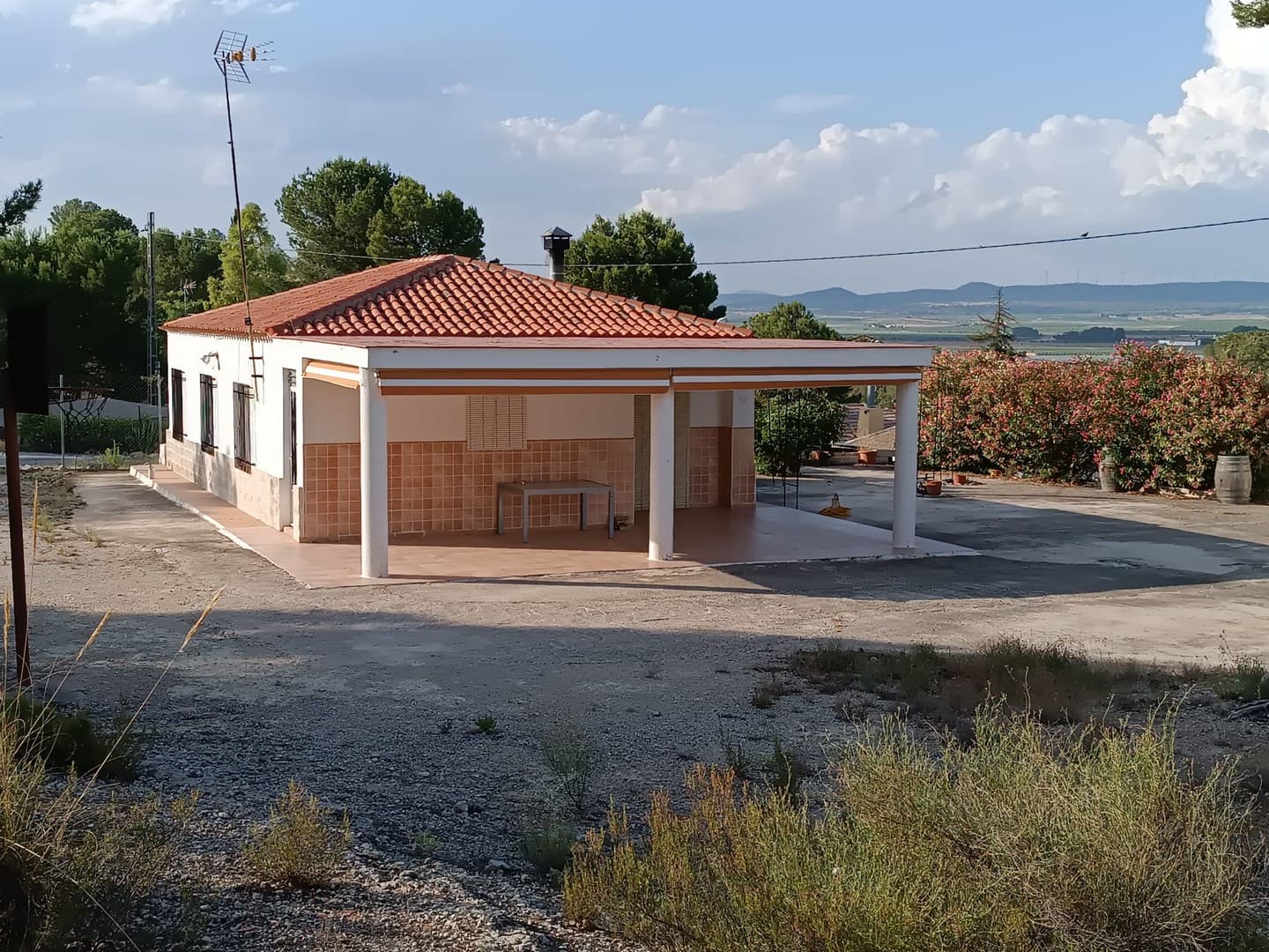 Are you looking for an affordable family home or a comfortable vacation retreat surrounded by nature and tranquillity? Discover this beautiful villa located in a rural serenity, 12 km from Yecla. Enjoy comfort, privacy and stunning views. This stylish property is in great condition, fully legalised and ready to move in. The house of 127 m2 features 3 bedrooms, a bathroom, a kitchen, cosy salon with a fireplace, air-conditioning, and a covered porch. The house, built from quality materials, is sold fully furnished and equipped, it has mains electricity and irrigation water.Highlight of this property is a spacious functional swimming pool of 50.000 l. The house sits on a fenced plot of 2.200 m2, offering privacy, BBQ area, and gardening possibilities. Furthermore, there are several outbuildings and a garage.Don't hesitate and contact us to arrange a visit!About the area: Yecla is renowned for its wine production, historical landmarks, and vibrant local culture. The surrounding natural landscapes provide opportunities for outdoor activities, while the town itself offers all necessary services, including schools, shops, and restaurants. This property combines the tranquility of countryside living with easy access to modern amenities.About us: We have a large portfolio of properties in the Costa Blanca and Costa Calida areas, specialising in country properties, villas, fincas, building plots and design and build options in the Alicante and Murcia regions with a particular emphasis on Elda, Monovar, Pinoso, Sax, Villena, Aspe, Fortuna, Albacete and many more surrounding areas. We have been established since 2004 and have decades of experience between the team which we bring to bear to help you find and secure your new dream home. We help you every step of the way to make sure your purchase in Spain is safe and hassle free. We are not here to sell you a property, we are here to help you realise your dream and find what is right for you. With us you are in the safest hands. Contact us now to have a no obligation chat about how you too can realise your dreams.