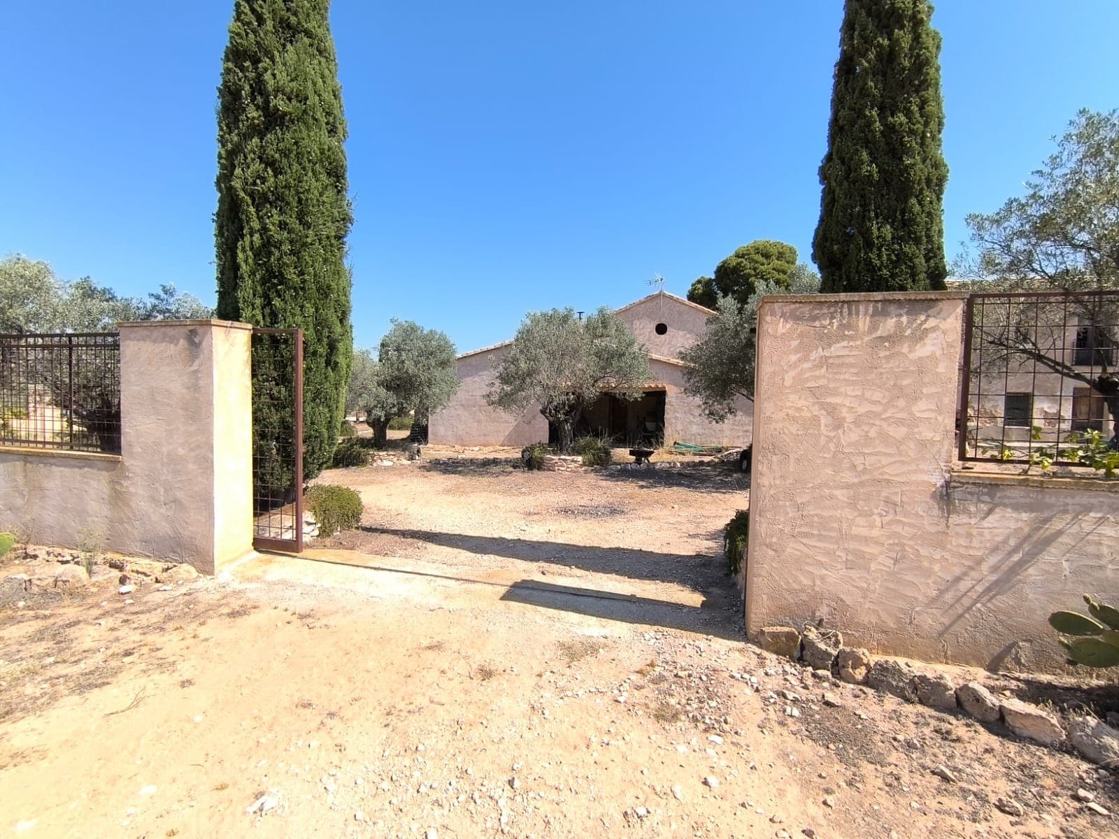 Unlock the potential of a remarkable property with endless opportunities in Alicante region! This expansive estate features:An old house with a garage, ripe for restoration, perfect for personal residence or conversion into charming accommodation. Not ready to use at the moment.An old winery adorned with large antique wine barrels, offering a unique space that can serve as storage or be transformed into a stylish reception area or bar, enhancing the guest experience.Elegant, fenced garden surrounding the main structures, that provides ample parking and adds to the atmosphere. The garden has two gates on the opposite sides.Over 141,000 m2 of flat, compact land with various points of access, ideal for various uses such as a campsite, minigolf, horse pasture, or sports fields - one particular idea is shown in the photos. More land in the vicinity could be bought if wanted.Nestled in a tranquil and picturesque location, this estate offers stunning mountain views and a peaceful environment, all while having a convenient access, just 4 km from the vibrant town of Villena and a mere 40-minute drive from Alicante airport and the Mediterranean beaches.Equipped with mains electricity, drinking water, and irrigation water connections, this property is ready for your vision. Don't miss this exceptional opportunity to invest in a property with tremendous tourist potential!About the Area: Villena is a picturesque medieval city rich in culture, history, and architecture. The town features two castles, beautiful churches, local markets, museums, and vibrant squares. The rich cultural life of the town includes famous festivals, such as historical event Moors and Christians, music events Rabolagartija and Leyendas Del Rock, annual Christmas fair or all-year-round wine fairs and tapas routes. Villena has a full range of services including restaurants, bars, shops, supermarkets, and schools. Alicante airport and Mediterranean beaches are only 40 minutes away, and Villena's high-speed rail station provides fast access to Alicante (35 minutes) and Madrid (2.5 hours). The surrounding landscape is perfect for nature lovers, with scenic trails, vineyards, and mountain views.About us: We have a large portfolio of properties in the Costa Blanca and Costa Calida areas, specialising in country properties, villas, fincas, building plots and design and build options in the Alicante and Murcia regions with a particular emphasis on Elda, Monovar, Pinoso, Sax, Villena, Aspe, Fortuna, Albacete and many more surrounding areas. We have been established since 2004 and have decades of experience between the team which we bring to bear to help you find and secure your new dream home. We help you every step of the way to make sure your purchase in Spain is safe and hassle free. We are not here to sell you a property, we are here to help you realise your dream and find what is right for you. With us you are in the safest hands. Contact us now to have a no obligation chat about how you too can realise your dreams.