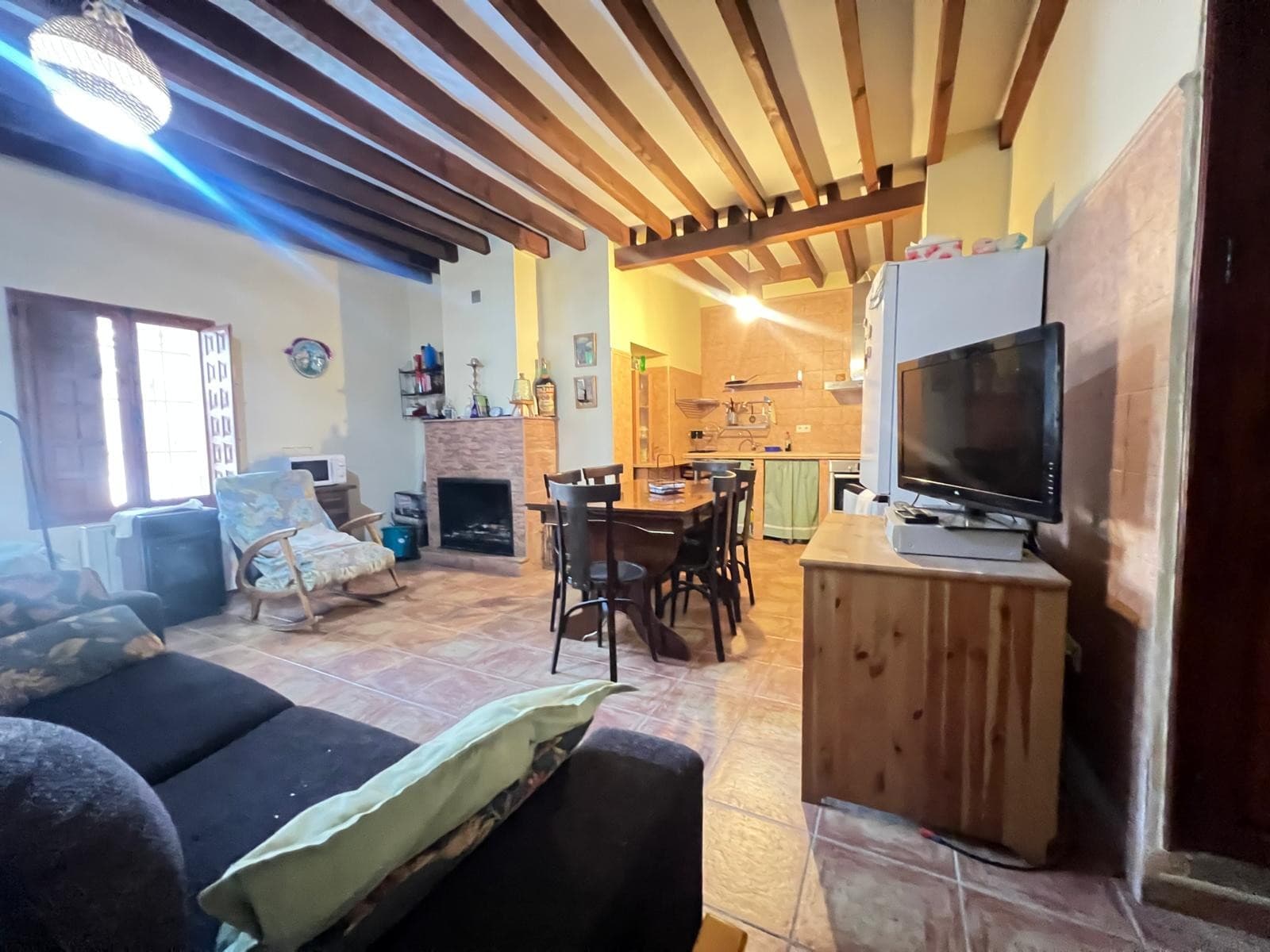 Located in the peaceful hamlet of Encebras, this spacious village house is perfect for those seeking a quiet rural lifestyle with the convenience of nearby services. Just a 7-minute drive from the popular town of Pinoso, where you'll find supermarkets, shops, restaurants, a health center, and more. The hamlet itself offers a friendly bar and a park, making it a lovely place to call home or spend holidays.The house is distributed over two floors and offers generous living space. On the ground floor, there is a large entrance hall, one bedroom, a cozy living room with a fireplace, and a spacious dining room with a second fireplace, adjacent to a rustic-style kitchen. From the dining area, you step out into a large patio and a full bathroom.Stairs from the patio lead down to a large basement featuring a barbecue area and a second patio — ideal for gatherings and outdoor living. Upstairs, the property offers four bright and spacious bedrooms, a bathroom, and a small storage room. A solarium on the upper level adds extra outdoor space to relax and enjoy the peaceful surroundings.This property is suitable both as a permanent family home and as a holiday rental investment. Its size, layout, and outdoor areas offer flexibility for a range of uses, whether you're looking to settle in a tranquil environment or generate rental income in a sought-after location close to amenities.With five bedrooms, multiple outdoor spaces, and plenty of character, this is a great opportunity to own a versatile home in one of the most charming rural areas near Pinoso.If you liked this property, do not hesitate to contact us to organize a visit, we will be happy to help you!We have a large portfolio of properties in the Costa Blanca and Costa Calida areas, specialising in country properties, villas, fincas, building plots and design and build options in the Alicante and Murcia regions with a particular emphasis on Elda, Monovar, Pinoso, Sax, Villena, Aspe, Fortuna, Albacete and many more surrounding areas. We have been established since 2004 and have decades of experience between the team which we bring to bear to help you find and secure your new dream home. We help you every step of the way to make sure your purchase in Spain is safe and hassle free. We are not here to sell you a property, we are here to help you realise your dream and find what is right for you. With us you are in the safest hands. Contact us now to have a no obligation chat about how you too can realise your dreams.