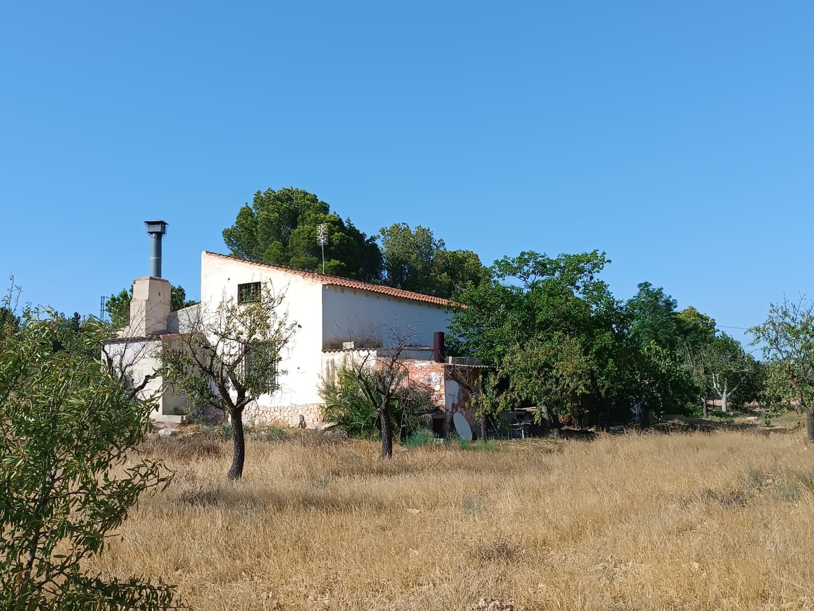 Are you looking for a new home for affordable price in quiet rural setting? Introducing a stunning country house with a large parcel and a swimming pool, 7 km from town of Yecla, close to nature and tranquillity. If you want to enjoy comfort, privacy and stunning views, and are looking for a house that's in a good condition and ready to move in, this is the property for you. With 222 m2 built, 125 m2 is dedicating to the living area, featuring 3 bedrooms, a bathroom, a cosy living room with a fireplace, and a kitchen. The rest of the building comprises of a garage, a storage area, and a covered porch. The house is sold fully furnished and is equipped with mains electricity and mains and irrigation water.Highlight of this property is a spacious functional swimming pool of 108.000 l, located just outside the covered porch. The house sits on a large plot of 18.000 m2, offering privacy and various possibilities for house extension, outbuildings or agricultural ventures. The plot is planted by various fruit trees for your own consumption, majority is planted with an almond orchard. Thanks to its size and location, the property is especially suitable for horse lovers!Don't hesitate and contact us to arrange a visit!About the area: Yecla is renowned for its wine production, historical landmarks, and vibrant local culture. The surrounding natural landscapes provide opportunities for outdoor activities, while the town itself offers all necessary services, including schools, shops, and restaurants. This property combines the tranquility of countryside living with easy access to modern amenities.About us: We have a large portfolio of properties in the Costa Blanca and Costa Calida areas, specialising in country properties, villas, fincas, building plots and design and build options in the Alicante and Murcia regions with a particular emphasis on Elda, Monovar, Pinoso, Sax, Villena, Aspe, Fortuna, Albacete and many more surrounding areas. We have been established since 2004 and have decades of experience between the team which we bring to bear to help you find and secure your new dream home. We help you every step of the way to make sure your purchase in Spain is safe and hassle free. We are not here to sell you a property, we are here to help you realise your dream and find what is right for you. With us you are in the safest hands. Contact us now to have a no obligation chat about how you too can realise your dreams.