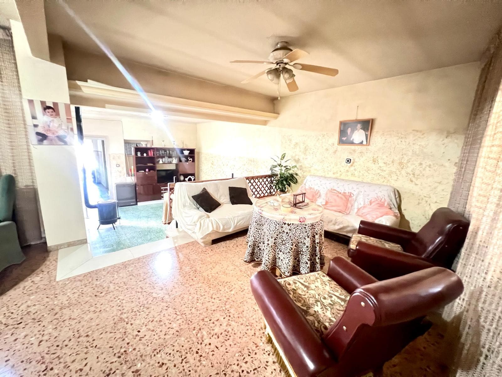 Discover this impressive single-storey house located in the heart of Pinoso, a property full of potential, ideal for a large family seeking space and comfort, or for investors looking for a property with great possibilities.Set on a 690 m² garden plot, the house offers a generous and functional layout with 6 bedrooms, 1 bathroom, and two bright patios that bring natural light into the home and create a perfect indoor-outdoor connection.The property features a large kitchen-dining room with a fireplace, perfect for family gatherings, as well as two additional living-dining rooms that open onto one of the patios, providing multiple areas for relaxation and entertainment. There is also a wood stove that adds warmth and charm to the home during the cooler months.One of its most remarkable features is the ample garage and storage space. There are five garages of 25 m² each, plus an additional garage room with direct access to the garden, offering fantastic possibilities for a workshop, business use, or to rent out for extra income.The spacious garden offers endless potential to create your own outdoor oasis , whether a pool, barbecue area, or vegetable garden, it can easily adapt to any lifestyle.Located within walking distance of all amenities, this property combines the tranquility of a residential area with the convenience of having shops, schools, restaurants, and services nearby.In summary, this is a large property full of character and opportunity, perfect for a big family or for investors looking to extend, renovate or enhance its great potential and value.We have a large portfolio of properties in the Costa Blanca and Costa Calida areas, specialising in country properties, villas, fincas, building plots and design and build options in the Alicante and Murcia regions with a particular emphasis on Elda, Monovar, Pinoso, Sax, Villena, Aspe, Fortuna, Albacete and many more surrounding areas. We have been established since 2004 and have decades of experience between the team which we bring to bear to help you find and secure your new dream home. We help you every step of the way to make sure your purchase in Spain is safe and hassle free. We are not here to sell you a property, we are here to help you realise your dream and find what is right for you. With us you are in the safest hands. Contact us now to have a no obligation chat about how you too can realise your dreams.