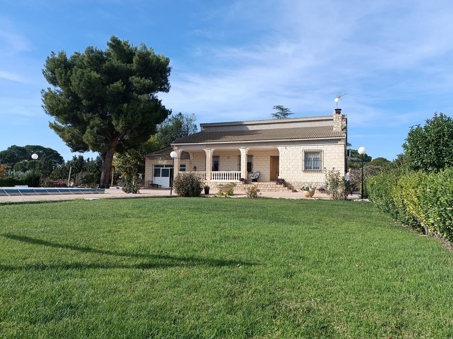 Set on a 8,800 m² plot, this remarkable detached villa offers a total built area of 397 m² - 198 m² dedicated to the residence, 78 m² to the impressive pool, 71 m² to the garage, and 50 m² to the barbecue area. every corner of this property is designed for enjoyment.The stunning 125,000-liter pool, lined with mosaic tiles and equipped with a full filtration system, is the perfect centerpiece for warm summer days. Inside, the home features 3 bedrooms with built-in wardrobes, 2 bathrooms (one with a shower and the other with a bathtub), a welcoming living-dining room with a fireplace, a solid oak kitchen, pantry, all from quality materials, and heated with central oil-fired heating.The separate barbecue area, complete with kitchen units and its own fireplace, invites gatherings all year round. A 25 m² porch and a spacious garage for up to 3 vehicles further enhance the property's functionality.Located in one of Yecla's most exclusive residential areas and just 2 km from the town center, the estate offers both convenience and tranquility. The fully fenced plot features rich, fertile soil and a very nice collection of fruit trees, including peach, olive, almond, apple, pear, and grapevines. Rarely you'll find houses of this size so close to the daily amenities.The property is connected to the mains electricity, and both drinking water and irrigation water - everything you need for comfortable country living.About the area: Yecla is a charming and historic town of app. 35000 inhabitants, located in the region of Murcia. It is renowned for its award-winning wines, historical landmarks, and vibrant local culture. The surrounding natural landscapes of scenic mountains, vineyards and almond groves provide opportunities for outdoor activities, while the town itself offers all necessary services, including hospital, schools, shops, restaurants, and other services. With a friendly local community, lively markets, excellent gastronomy, and easy access to nature, Yecla is an ideal location for those seeking authentic Spanish lifestyle - just about an hour from the coast and Alicante airport.About us: We have a large portfolio of properties in the Costa Blanca and Costa Calida areas, specialising in country properties, villas, fincas, building plots and design and build options in the Alicante and Murcia regions with a particular emphasis on Yecla, Novelda, Elda, Monovar, Pinoso, Sax, Villena, Aspe, Fortuna, Jumilla, Abanilla, and many more surrounding areas. We have been established since 2004 and have decades of experience between the team which we bring to bear to help you find and secure your new dream home. We help you every step of the way to make sure your purchase in Spain is safe and hassle free. We are not here to sell you a property, we are here to help you realise your dream and find what is right for you. With us you are in the safest hands. Contact us now to have a no obligation chat about how you too can realise your dreams.