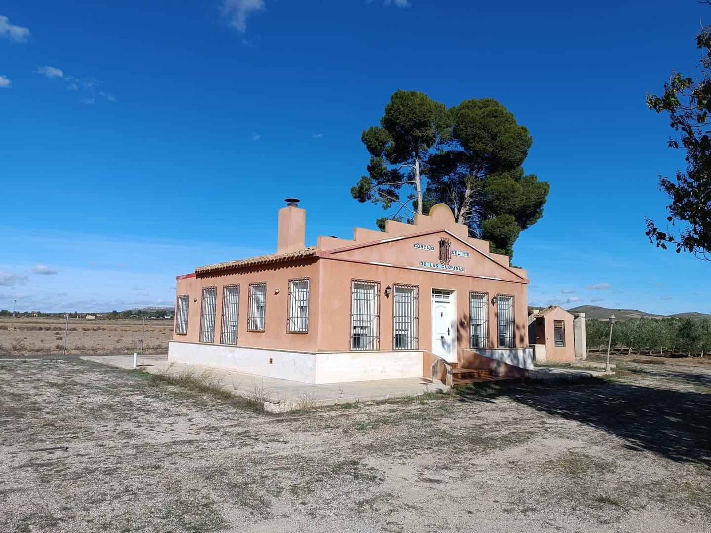 Charming country villa with working olive farm, just under 4 km from Yecla. Set within a fully fenced plot of more than 23,000 m², it features a well-built 120 m² home surrounded by an olive grove of 1,900 trees in full production. With drip-irrigation and an average annual yield of around 15,000 kg, the estate offers excellent potential for additional income with minimal maintenance - ideal for those seeking a self-sufficient lifestyle in the countryside.Main House The 120 m² residence is spacious, stylish, and thoughtfully arranged. The open-plan living room with integrated kitchen creates a welcoming environment ideal for everyday living and social gatherings. A wood-burning stove provides warmth in the cooler months. The house features 2 full bathrooms and 2 bright bedrooms. Both indoor and outdoor barbecue areas, along with a dedicated dining pergola, make the home perfect for year-round outdoor enjoyment.Exterior and Features The extensive plot offers maximum privacy and multiple possibilities. There are 1,900 olive trees in full production, maintained and harvested mechanically. Furthermore, approximately 5,000 m² of the land is unplanted and available for growing a wide variety of fruits and vegetables for personal use. The estate benefits from guaranteed irrigation water, a photovoltaic solar system for efficient energy self-consumption, and a covered parking area with capacity for four vehicles. Its size and layout also make it particularly suitable for keeping horses, dogs, or other animals.A peaceful haven immersed in nature, ideal for full-time alternative living, or unforgettable weekend getaways with additional income.About the area: Yecla is a charming and historic town of app. 35000 inhabitants, located in the region of Murcia. It is renowned for its award-winning wines, historical landmarks, and vibrant local culture. The surrounding natural landscapes of scenic mountains, vineyards and almond groves provide opportunities for outdoor activities, while the town itself offers all necessary services, including hospital, schools, shops, restaurants, and other services. With a friendly local community, lively markets, excellent gastronomy, and easy access to nature, Yecla is an ideal location for those seeking authentic Spanish lifestyle - just about an hour from the coast and Alicante airport.About us: We have a large portfolio of properties in the Costa Blanca and Costa Calida areas, specialising in country properties, villas, fincas, building plots and design and build options in the Alicante and Murcia regions with a particular emphasis on Yecla, Novelda, Elda, Monovar, Pinoso, Sax, Villena, Aspe, Fortuna, Jumilla, Abanilla, and many more surrounding areas. We have been established since 2004 and have decades of experience between the team which we bring to bear to help you find and secure your new dream home. We help you every step of the way to make sure your purchase in Spain is safe and hassle free. We are not here to sell you a property, we are here to help you realise your dream and find what is right for you. With us you are in the safest hands. Contact us now to have a no obligation chat about how you too can realise your dreams.