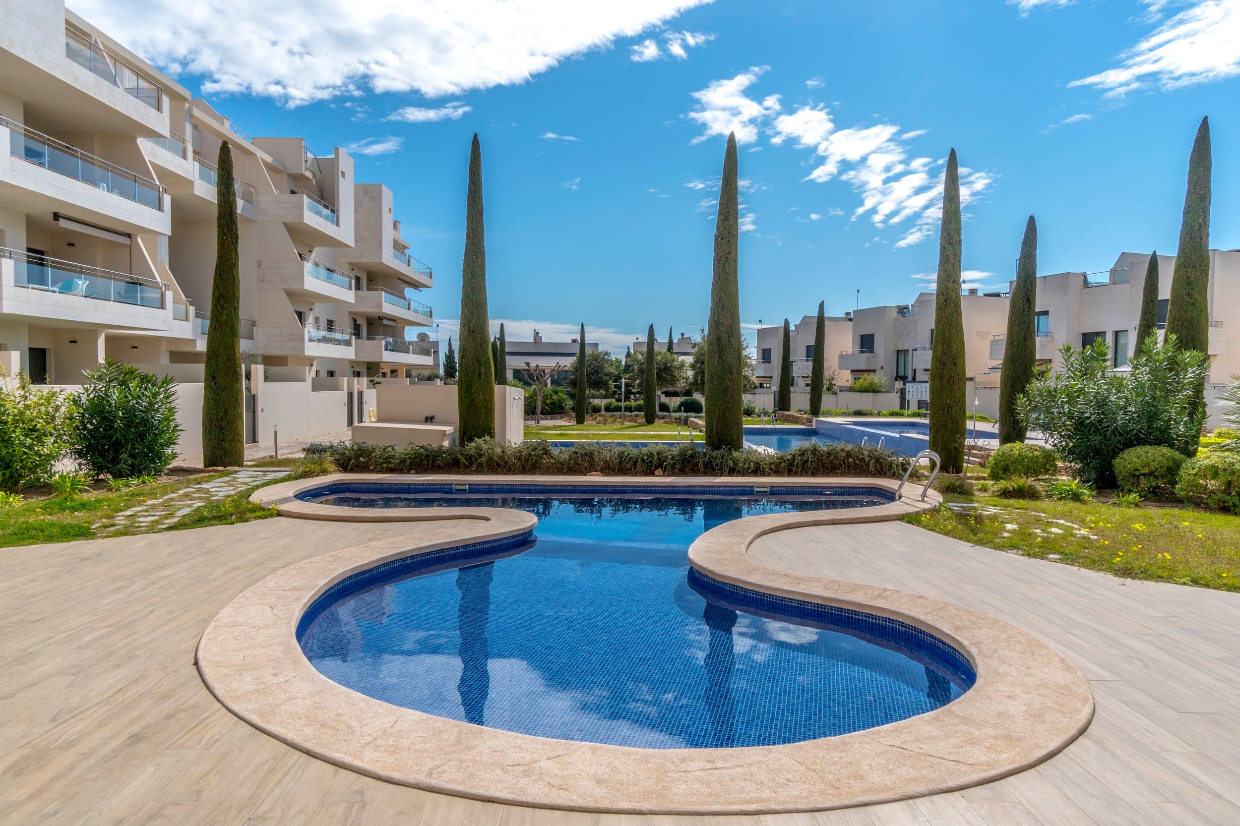 Modern apartment in Jardines de Montesolana, Orihuela Costa.This partment distributed in two bedrooms and two bathrooms. It has a spacious living-dining room with open plan kitchen and direct access to the large garden of 43 m2 with views to the communal areas of the residential with south orientation. It is located in the Jardines de Montesolana development which has a communal swimming pool and garden areas. This residential is close to La Zenia Boulevard shopping centre (Orihuela Costa). La Zenia is close to Cabo Roig, Campoamor and Playa Flamenca. It is a growing area, close to all amenities and the famous La Zenia Boulevard shopping centre. Only a few minutes from the N-332 and the Mediterranean motorway AP-7 towards Alicante and Cartagena. There are also around the golf courses of Villamartin, Las Ramblas, Campoamor and Las Colinas.