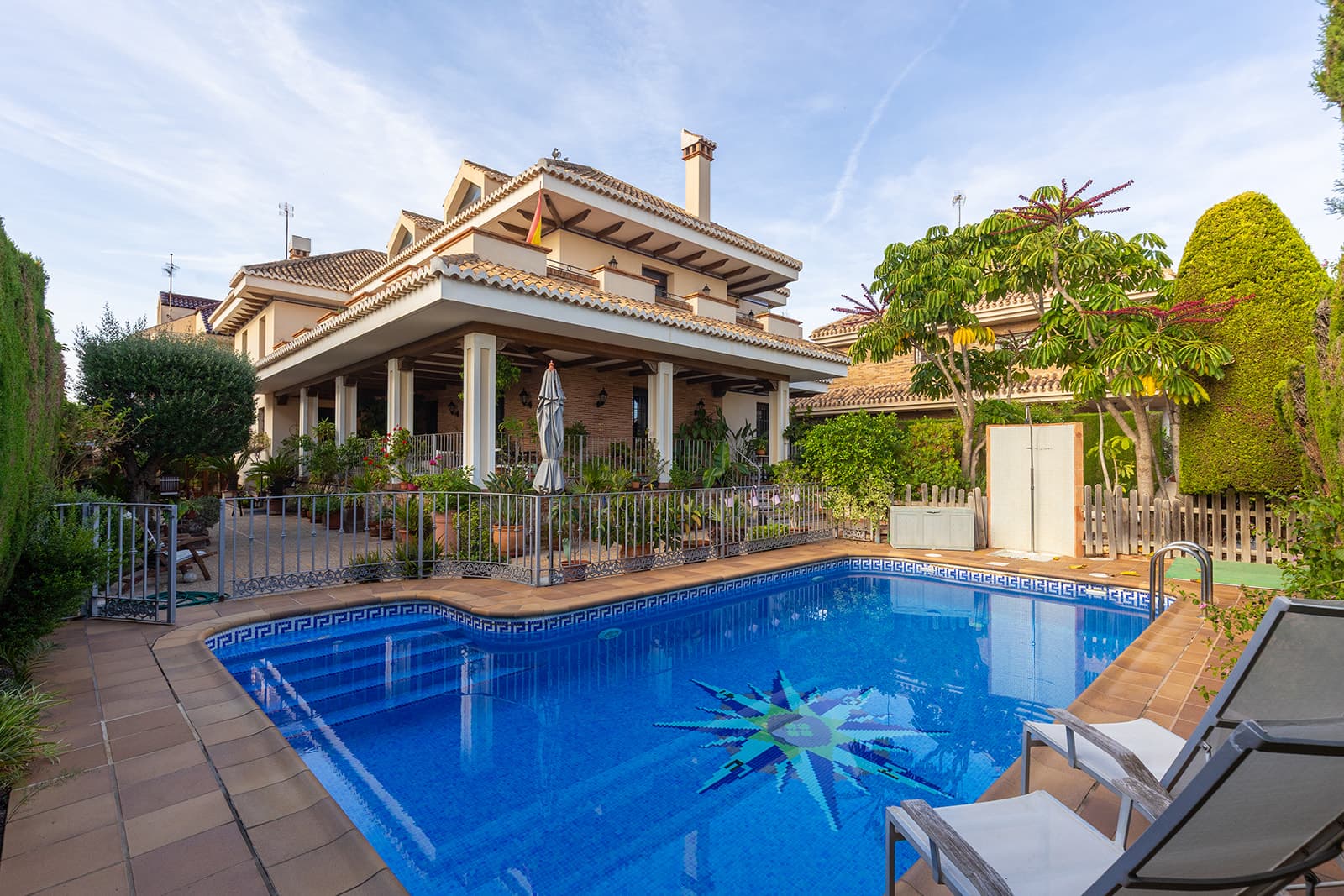 Discover this luxury detached villa for sale in La Veleta, Torrevieja (Costa Blanca South) — one of the most exclusive and sought-after areas for international buyers looking to buy a property near the sea in Spain.Built on a 700 m² plot, this stunning home offers more than 700 m² of constructed area across several levels, combining elegant Mediterranean architecture with the comfort of a modern home. The exterior features traditional tiled roofs, wooden beams, and spacious terraces surrounded by lush greenery.On the main floor, you’ll find a bright living room with fireplace, an elegant dining area, a charming music room, and a fully equipped kitchen finished in natural wood and granite. The interiors are warm and inviting, with handcrafted ceramic floors, ironwork details, and abundant natural light.Upstairs, the villa features large, sunlit bedrooms, including a master suite with private bathroom and terrace. The attic level offers a versatile open space, perfect as an office or leisure area.Outside, the property offers a private swimming pool, covered terraces, a built-in barbecue and wood oven, and a beautifully landscaped Mediterranean garden. The basement includes a spacious garage for multiple vehicles, storage, and a utility room.Located in the prestigious La Veleta residential area, this property enjoys peace, privacy, and proximity to the sea — just a few minutes from Torrevieja’s best beaches, international schools, supermarkets, and restaurants.A perfect opportunity for those seeking to buy a luxury villa in Spain — ideal as a permanent residence, holiday home, or exclusive investment on the Costa Blanca.Keywords: luxury villa for sale in La Veleta, villa for sale in Torrevieja, Costa Blanca property for sale, Spanish villa near the sea, detached villa with private pool, buy villa in Spain.