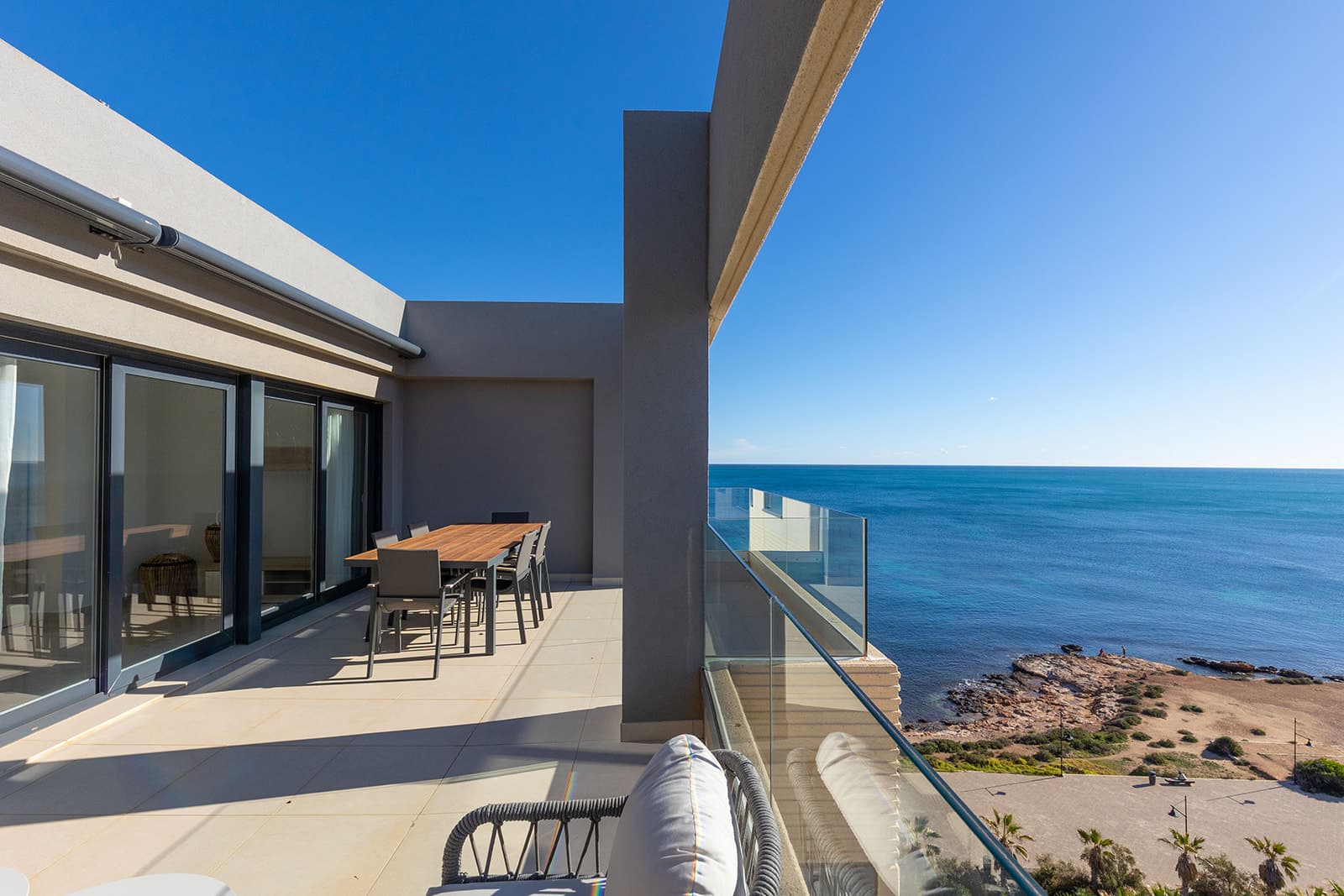 We present this magnificent 3-bedroom, 2-bathroom penthouse with 139 m², located in the prestigious Panorama Mar residential complex, one of the most modern and highly regarded developments in Punta Prima. Situated frontline, it offers stunning open views of the Mediterranean and a privileged setting for those seeking quality, comfort, and exclusivity by the sea.The property features a spacious and bright 28 m² south-facing terrace, perfect for enjoying the sun all day, the sea breeze, and unbeatable panoramic views. The interior layout is modern and functional, with generous rooms filled with natural light, designed to maximize comfort.The penthouse includes an underground parking space and a storage room, providing additional convenience and extra storage.Panorama Mar is a modern frontline complex that stands out for its large swimming pools, including a heated pool, landscaped areas, and relaxation zones with sea views. It offers an exclusive, secure, and well-maintained environment, ideal for enjoying the Mediterranean lifestyle all year round.Located in one of the most privileged areas of the Costa Blanca, Punta Prima combines tranquility and convenience. The property is just a few steps from the beach and surrounded by restaurants, supermarkets, and leisure options, while being very close to Zenia Boulevard and several prestigious golf courses.