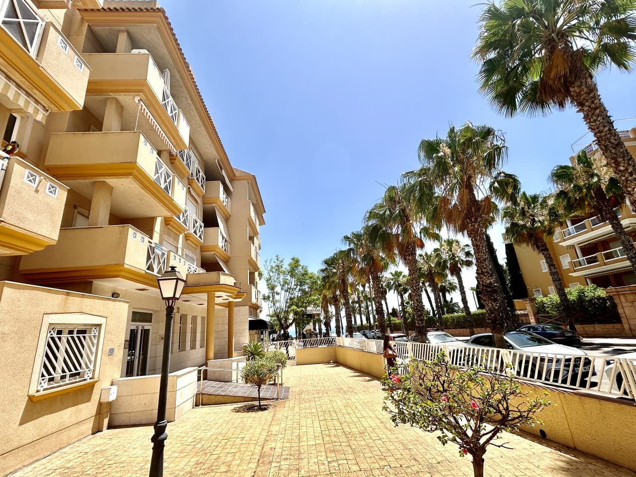 Enjoy the very best of coastal living in this beautifully situated 2-bedroom, 2-bathroom apartment in the heart of Cabo Roig. Perfectly positioned just a few steps from the beach, you’ll also have an excellent selection of lively bars, restaurants, cafés, and shops right on your doorstep, meaning everything you need is within easy walking distance.The apartment offers a private balcony with sea views, the ideal spot to relax with a morning coffee or unwind in the evening as the sun sets over the Mediterranean. Guests also have access to a communal rooftop terrace with breathtaking panoramic views, providing a perfect setting for sunbathing or enjoying warm summer nights.Every Thursday, the famous Cabo Roig street market comes alive just outside your door, offering fresh local produce, fashion, gifts, and a vibrant atmosphere that captures the spirit of the area.Inside, the apartment features two spacious bedrooms, two bathrooms, a fully equipped kitchen, and a comfortable living and dining area designed for easy holiday living. Private parking is also included, adding extra convenience for those who choose to explore further along the Costa Blanca.This is the ideal base for beach lovers, food enthusiasts, golfers, and anyone looking to experience the relaxed Mediterranean lifestyle in one of Orihuela Costa’s most sought-after locations.