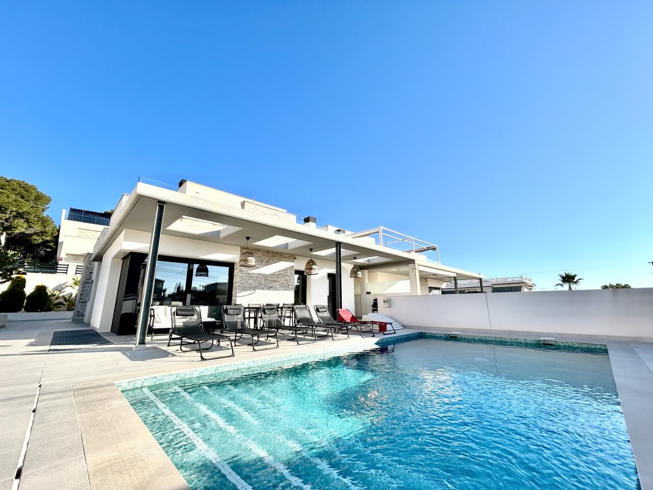 Discover an exceptional villa that blends contemporary elegance with relaxed Mediterranean charm in the highly sought-after area of Los Balcones, Torrevieja. Set on a private plot, this stunning 5-bedroom, 4-bathroom residence is offered fully furnished, allowing you to move in and start enjoying the lifestyle immediately.The villa welcomes you with generous, sun-filled interiors, high-quality finishes, and a seamless flow throughout. Stylish furnishings complement the modern design, while each bedroom offers comfort and privacy. The beautifully appointed bathrooms reflect refined taste and attention to detail. The heart of the home opens onto a private swimming pool, creating the perfect setting for entertaining, family gatherings, or tranquil afternoons under the Spanish sun.Outside, the landscaped terraces provide multiple areas to relax and dine al fresco, and the private garage ensures convenience and security. Every detail of this home has been carefully considered to deliver both elegance and functionality.Located just minutes from beaches, golf courses, shops, and restaurants, this villa offers the ideal balance of exclusivity and accessibility—perfect as a permanent residence, luxury holiday home, or high-end investment.Key Features:Fully furnished5 spacious bedrooms & 4 modern bathroomsPrivate swimming poolPrivate garageElegant, light-filled interiorsPrime location in Los Balcones, TorreviejaA truly gorgeous villa that captures the essence of luxury living on the Costa Blanca.