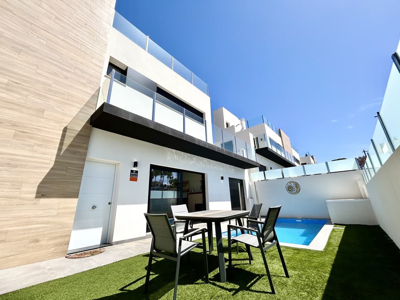 Discover this exceptional newly built home, completed in 2025, offering the perfect combination of modern design, comfort, and outdoor living in one of Villamartin’s most desirable locations.This beautifully presented 2-bedroom, 2-bathroom semi-detatched villa has been designed with a focus on space, natural light, and effortless Mediterranean living. The property comes fully furnished and is ready to move into, making it the ideal choice for a permanent home, holiday retreat, or investment opportunity.The villa boasts a fantastic selection of outdoor spaces, including a private swimming pool, private parking, front and rear garden areas, and three separate terraces — giving you the perfect setting to enjoy the Spanish sunshine throughout the day. The impressive private solarium provides the ultimate place to relax, entertain guests, or enjoy stunning open views.Inside, the home features a bright and modern open-plan kitchen and living area, creating a stylish and welcoming space for everyday living. Additional features include air conditioning, a solar energy system, and electric shutters, offering comfort, efficiency, and modern convenience.Located in the sought-after area of Villamartin, close to a wide range of amenities, restaurants, golf courses, and just a short drive from the beautiful Costa Blanca coastline, this villa offers everything needed to enjoy the Mediterranean lifestyle.A fantastic opportunity to own a brand-new villa combining quality, style, privacy, and an unbeatable location.