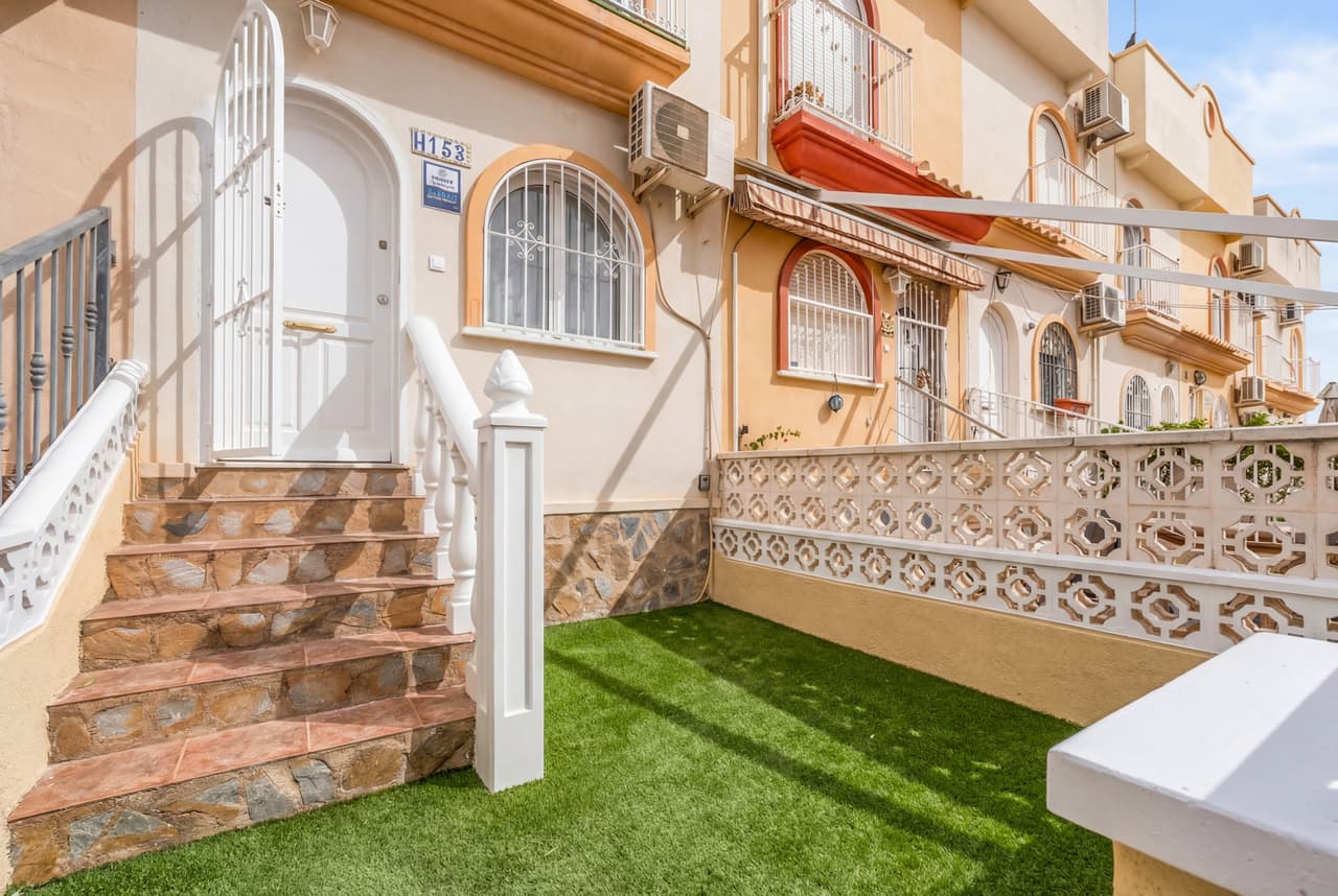 This stunning fully renovated 2-bedroom, 1.5-bathroom townhouse is ideally situated in the sought-after area of La Florida, just a short stroll from the vibrant Via Park, known for its excellent selection of bars, cafés, and restaurants.The property has been thoughtfully modernised throughout, offering a stylish and move-in-ready home perfect for holidays, rental investment, or year-round living.The ground floor features a bright and welcoming living area, a contemporary kitchen, and a convenient guest toilet. Outdoors, the home enjoys terraces on both the east and west sides, allowing you to enjoy sunshine or shade throughout the day—ideal for outdoor dining, relaxing, or entertaining.Upstairs, you’ll find two well-proportioned bedrooms and a modern family bathroom. One of the bedrooms opens onto a private balcony, which leads directly to a spacious rooftop solarium. From here, you can take in beautiful panoramic sea views, making it the perfect space for sunbathing, evening drinks, or simply enjoying the Mediterranean lifestyle.The location is unbeatable:Minutes from the popular shopping and leisure destination La Zenia BoulevardA short drive to the sandy beaches of Punta PrimaSurrounded by amenities, golf courses, and excellent transport linksThis is a rare opportunity to own a stylish, turnkey townhouse in one of the Costa Blanca’s most convenient and lively residential areas.
