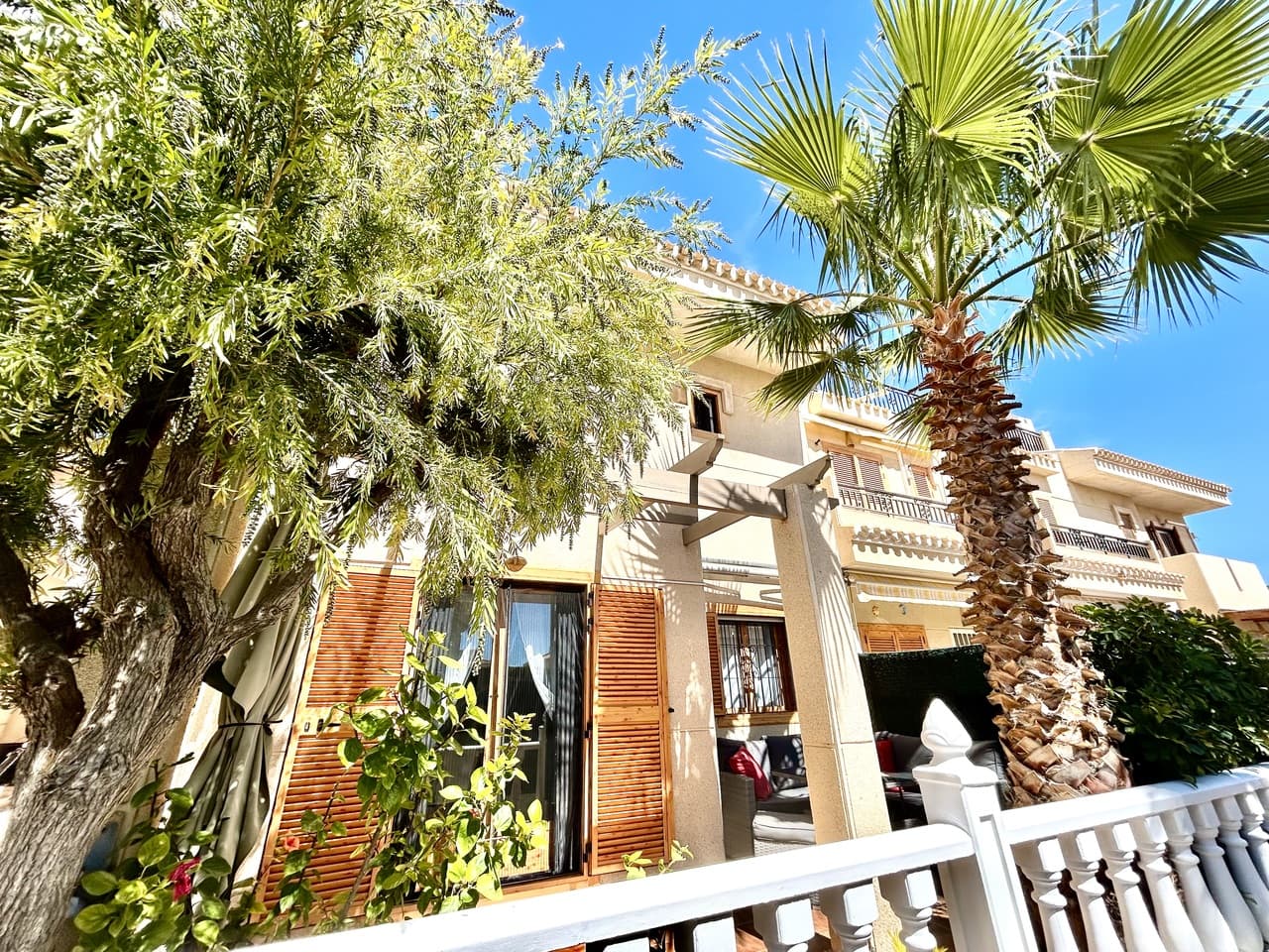 Located in the highly sought-after area of Playa Flamenca, this gorgeous and spacious 2-bedroom, 2-bathroom townhouse offers the perfect combination of comfort, convenience, and Mediterranean lifestyle.Set within a secure gated urbanisation, the property provides both privacy and peace of mind, while benefiting from access to a well-maintained communal pool—ideal for relaxing and enjoying the sunshine.The home itself is beautifully presented and truly walk-in ready, featuring bright, airy interiors filled with natural light. The generous living spaces flow effortlessly, creating a warm and inviting atmosphere throughout. A sunny terrace at the front of the property offers the perfect spot for outdoor dining or simply unwinding in the sun.Upstairs, the master bedroom boasts its own private sunny balcony, creating a retreat to enjoy your morning coffee or evening breeze. A central heating system connected to mains gas ensures year-round comfort, making this home ideal for both permanent living and holidays.A private garage can also be purchased seperately, adding both convenience and valuable storage space.Perfectly positioned within walking distance to the famous Playa Flamenca Market and the ever-popular La Zenia Boulevard, as well as a wide range of restaurants, bars, and everyday amenities, this property offers an unbeatable location.Whether you’re looking for a permanent residence, holiday home, or investment opportunity, this exceptional townhouse ticks all the boxes.