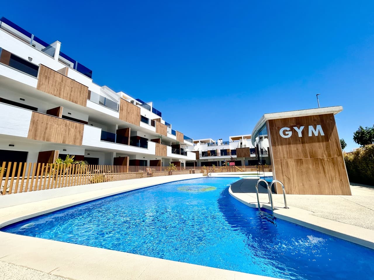 Welcome to this exceptional 2-bedroom, 2-bathroom corner apartment in the highly sought-after Lamar Resort VII in Pilar de la Horadada, completed in 2023 and presented in immaculate modern condition.Positioned on a desirable corner plot, the apartment boasts a spectacular wraparound terrace, offering an abundance of outdoor space to relax, dine, and entertain while enjoying beautiful sea views and overlooking the stunning communal swimming pool. The unique layout allows natural light to flood the property throughout the day, creating a bright and airy atmosphere.Designed with contemporary style and comfort in mind, the apartment features a spacious open-plan living area, high-quality finishes, and modern bathrooms, making it ideal for both permanent living and luxurious holiday escapes.The property also benefits from a private parking space in the secure underground garage along with a large private storeroom, providing excellent practicality and additional storage.Located in one of the most desirable resorts in Pilar de la Horadada, close to beaches, restaurants, shops, and sports facilities, this is a fantastic opportunity to own a nearly new apartment in a prime Costa Blanca location.