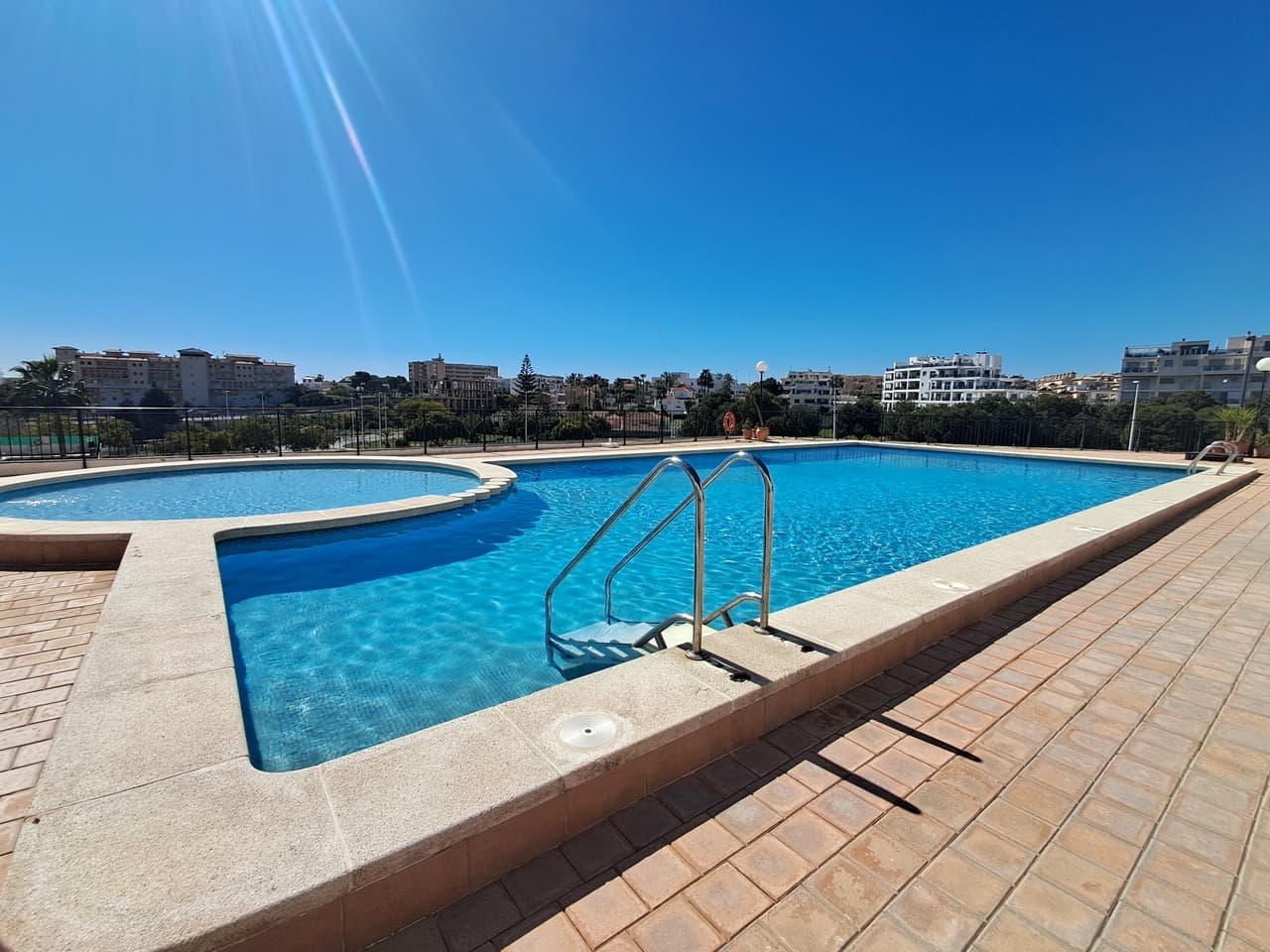 Discover this charming first-floor apartment located in the sought-after area of Molino Blanco, La Zenia. Offering 2 well-proportioned bedrooms and 1 bathroom, this property is perfect as a holiday home, rental investment, or permanent residence.The apartment benefits from lift access, ensuring convenience for all ages, and is set within a well-maintained community featuring a beautiful communal pool—ideal for relaxing and enjoying the Mediterranean climate.Inside, the property is bright and welcoming, and it is being sold fully furnished, allowing for a smooth and hassle-free move-in. The layout maximizes space and comfort, with a cozy living area and a functional kitchen.Situated close to local amenities, beaches, and popular shopping and dining areas, this apartment offers both convenience and lifestyle in one of the Costa Blanca’s most desirable locations.