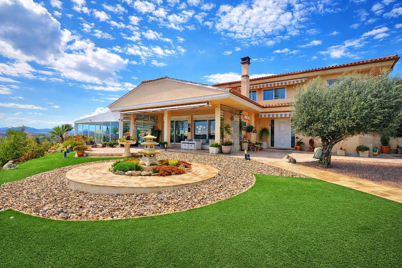 Once in a lifetime opportunity to purchase an incredible villa on a huge 11,000m2 plot with breath-taking views over Embalase de la Pedrera reservoir in Torremendo. This huge elevated plot is easily accessed from the main road with a private road leading up towards the main villa and fully landscaped garden with private swimming pool, double garage, the horse stables and vast paddock area. The villa has been built to very high specification with many special features and extras including solar panels, heated swimming pool with electric roof, double garage and separate storage room, oil central heating, air-conditioning, log burner, hidden utility room, plus a lot more. The villa has a very thoughtful layout that flows with high ceilings and floor to ceiling windows that make the absolute most of the spectacular views across the lake, lemon groves and reservoir. On the ground floor of the property there are three double bedrooms, a family bathroom with shower and bathtub, the fantastic L-shaped living and dining room which leads into the fully equipped bespoke kitchen. To the rear of the kitchen is a covered terrace and storage area which wraps around to the swimming pool. This area has direct views across Torremendo and the reservoir and no expense has been sparred with the installation of the heated pool and electric roof to make this space useable all year round. The impressive master bedroom is accessed from a private staircase in the living room where you will find the bespoke en-suite bathroom with walk in shower, bathroom and luxurious vanity unit. The master bedroom also has a walk in dressing room along with a private terrace overlooking the vast plot towards the Embalse de la Pedrera reservoir, Vega Baja mountain range and the pretty lemon groves. Outside, the garden has been beautifully landscaped with ornamental stones, Mediterranean trees and plants and is maintained to an immaculate standard. The main plot is accessed via electric gates where there is also the purpose built double garage along with a large storage room and boiler room. The property also boasts an equestrian area with four beautiful stables, the tack room, and paddock area which leads down to another plot with a small summer house. The potential to develop this space into a business is huge. This property is sold furnished and really must be seen to be truly appreciated.