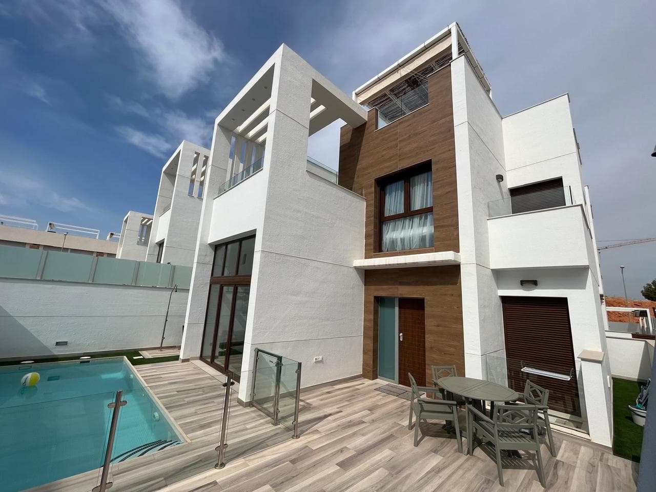 Discover your dream home in this exquisite villa that offers the perfect blend of year-round living and idyllic extended holidays. Boasting breathtaking views of the Pink Lakes of Torrevieja and the sea, this property is nestled in the heart of nature with convenient access to essential services. The community features a generously sized communal pool, while the villa itself comes complete with a private swimming pool, providing the ideal setting for relaxation and entertainment. The living space is bathed in natural light, thanks to large windows that offer a captivating view of the pool. The open-plan kitchen, styled in a modern Scandinavian fashion, seamlessly connects to the lounge, creating a welcoming and contemporary atmosphere. On the ground floor, a spacious bedroom with an ensuite bathroom awaits, along with an additional bathroom for the convenience of guests. The property also provides direct access to the forth bedroom/living room from the inside, currently utilized as living room and cinema area. Venture to the first floor to discover two more generously sized bedrooms and another bathroom. Large terraces and a solarium contribute to the allure of this property, ensuring you can fully savor the vibrant Spanish lifestyle. Inside garage and utility room will come with the property. Situated in the charming area of Orihuela Costa, this home offers proximity to the renowned Pink Lakes of Torrevieja, providing a scenic backdrop for daily living. Torrevieja, a coastal town nearby, further enhances the appeal with its vibrant atmosphere, offering a myriad of amenities, cultural experiences, and pristine beaches. Secure your opportunity to experience the epitome of Mediterranean living - book your viewing now and step into a world of luxury and comfort. The house has a tourist license.