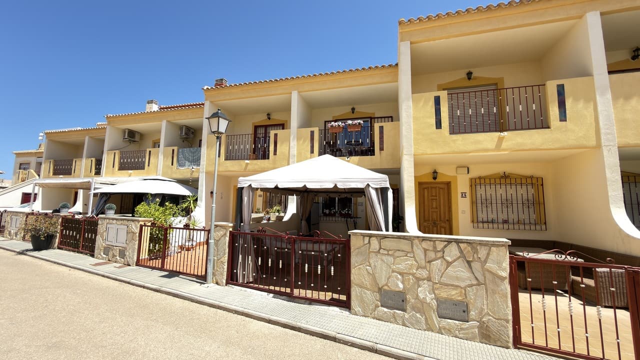**Spacious 3-Bedroom Townhouse with Sea Views in Prime La Zenia Location**This attractive 3-bedroom, 2-bathroom townhouse is ideally situated within a secure gated community, just a 10-minute walk from both La Zenia Beach and La Zenia Boulevard shopping centre.The property offers generous living space throughout, featuring three large and usable bedrooms, two full bathrooms, a modern kitchen, and front and rear garden areas perfect for outdoor living. The home has been slightly reformed, combining modern comforts with excellent potential for personalisation.The ground floor comprises a bright and spacious living room, a full bathroom, and a modern kitchen located at the rear, with direct access to the back patio. Both the front and rear outdoor areas provide ideal spaces for dining, relaxing, or entertaining.On the first floor, you will find two spacious bedrooms and a family bathroom. One of the bedrooms benefits from its own private balcony.The top floor is dedicated to a large master bedroom with access to a private balcony offering beautiful sea views, creating the perfect retreat to enjoy the Mediterranean lifestyle.Residents of the community have access to a communal swimming pool and secure gated parking.This property is an excellent choice as a permanent residence, holiday home, or investment opportunity thanks to its sought-after location, spacious layout, and proximity to all amenities.