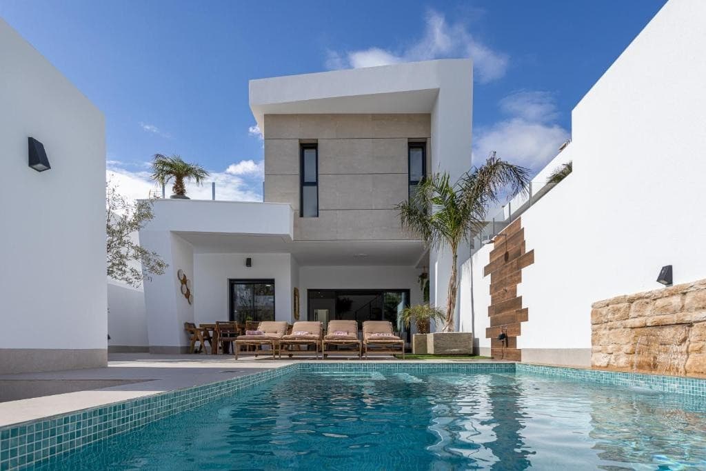 Modern Detached Villa Next to a City Park with Private Pool and Tourist LicenseThis exceptional, nearly new detached villa enjoys a prime location next to a beautiful city park, offering the perfect combination of tranquility, privacy, and a green natural setting while still being close to all daily amenities. Thanks to this unique location, you can enjoy peaceful surroundings, walking areas, and open green views, with shops, restaurants, and beaches all within easy reach.Set on a private plot of 238 m² with a total built area of approximately 150 m², this property perfectly combines modern design, comfort, and investment potential.Bright Living Spaces with Green ViewsUpon entering the villa, you are welcomed into a bright and spacious living area where large windows create a seamless connection with the outdoor space and the nearby park. The open-plan layout and contemporary architecture provide an airy atmosphere filled with natural light.The stylish fully equipped open kitchen is fitted with high-quality electrical appliances, making it ideal for both everyday living and entertaining family and friends.3 Bedrooms and Versatile Additional SpaceThe villa features:3 spacious bedrooms2 modern bathrooms1 guest toiletIn addition, the large basement level, currently in shell condition, offers endless possibilities. This versatile space can easily be transformed into:Additional bedroomsA guest apartmentGym or fitness roomHome cinemaOffice or hobby roomThis makes the property not only ideal as a permanent residence or holiday home, but also an excellent investment opportunity.Enjoy Outdoor Living Surrounded by Green AreasThe outdoor area is a true private oasis featuring a 6x3 meter swimming pool, surrounded by a spacious sun terrace where you can relax in total privacy. The location next to the city park creates an additional sense of openness and greenery around the property.The low-maintenance garden has been designed to fully embrace the relaxed Mediterranean lifestyle, offering plenty of space for outdoor dining, sunbathing, and enjoying the pleasant climate all year round.The villa also includes a secure private parking space on the plot.Fully Furnished and Ready to Move InThe property comes equipped with modern features designed for maximum comfort and energy efficiency, including:Central air conditioningHigh-quality finishesFull furnishing throughoutThe villa is sold fully furnished and is completely ready for immediate occupancy or rental.Tourist License and Existing Rental BookingsA major advantage of this property is the valid tourist rental license, making it an outstanding turnkey investment opportunity with strong rental potential.There are also existing rental bookings already confirmed until 13/09, allowing the future owner to benefit from immediate rental income.A Unique Combination of Green Surroundings, Luxury, and Investment PotentialThis modern villa stands out thanks to its exceptional location next to the city park, combined with:Luxury living comfortPrivacy and tranquilityContemporary architectureExcellent rental potentialA rare opportunity to acquire a fully move-in-ready villa in a prime location where green surroundings, relaxation, and the Mediterranean lifestyle come together perfectly.