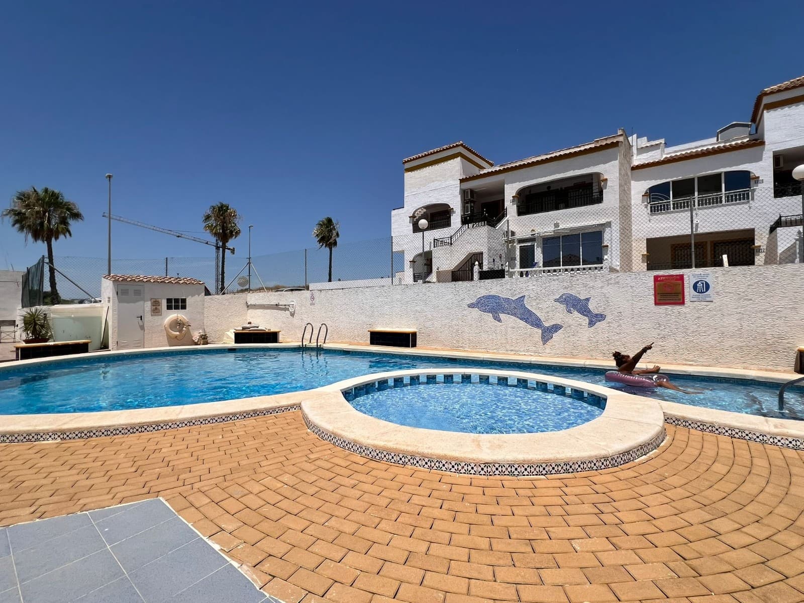 Enjoy comfortable Spanish living in this beautiful south-facing apartmentDiscover this charming ground floor apartment with 2 bedrooms and 1 bathroom on the Costa Blanca, an ideal property for those looking for a holiday home, permanent residence, or a smart investment opportunity in Spain.This fully south-facing property offers a wonderful outdoor living space thanks to its large, enclosed and glazed sun terrace. Equipped with a practical sun awning, this terrace is the perfect place to relax, enjoy the Spanish sunshine all year round, or spend quality time with family and friends.A few steps higher, you will find an additional covered terrace with a table and chairs, offering the perfect spot to enjoy breakfast in the morning sun or relax peacefully with a good book.This apartment combines comfort, location, and quality of life – exactly what many international buyers are looking for when purchasing property on the Costa Blanca.Property Features & LayoutThe apartment offers a practical and comfortable layout including:✅ 2 comfortable bedrooms✅ 1 well-maintained bathroom✅ Spacious living area with dining space and lounge✅ Beautifully furnished interior with sofa and TV unit✅ Air conditioning in the living room for year-round comfort✅ Large south-facing enclosed sun terrace✅ Additional covered terrace for morning sunshine and relaxationThe bright living room is the heart of the home. The combination of the dining area, comfortable seating space, and natural light creates a warm and inviting atmosphere.Thanks to the south orientation, you can enjoy maximum sunshine and the wonderful Mediterranean climate that makes the Costa Blanca one of the most desirable regions in Spain.Why Choose the Costa Blanca?The Costa Blanca is one of the most popular regions in Spain for Belgian and Dutch buyers. The perfect combination of sunshine, sea, nature, and relaxed Mediterranean lifestyle makes this area extremely attractive.Advantages of living on the Costa Blanca:☀️ More than 300 days of sunshine per year🌊 Beautiful beaches and a relaxed coastal lifestyle⛳ Excellent golf courses nearby🍽️ Fantastic gastronomy with local markets and restaurants✈️ Easy access through international airports🏡 Excellent opportunities for property investmentWhether you are searching for an apartment in Spain, a villa on the Costa Blanca, a home close to the sea, or a modern new build property in Spain, this region offers opportunities for every lifestyle.