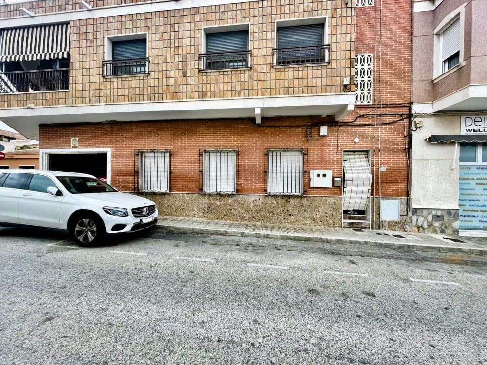 wp:paragraph Ground-floor apartment in the heart of Los MontesinosExcellent investment opportunity in one of the most sought-after areas of Los Montesinos. This ground-floor apartment, with no stairs and easy access, is located in the heart of the town, just a few meters from the Town Hall and less than 200 meters from all kinds of shops, services, and leisure areas.The property needs renovation, although it offers great potential to become a modern, functional home with a personalized design.Upon entering the property, you will find a good-sized living-dining room that invites you to relax and share time with the family. It has four bedrooms, three of which are spacious and enjoy excellent natural light. The fourth bedroom can be used as a dressing room, game room, office, gym, or for another purpose, depending on your needs.The full bathroom has a shower and window, ensuring natural light and optimal ventilation. A practical utility room facilitates storage and laundry.The separate, well-sized kitchen has a fireplace and can be converted into an open-plan American-style kitchen connected to the living room. From there, there is access to a patio with an outdoor kitchen, an additional sink, and stairs leading to the upper storage room.The home includes a garage with an electric door and direct access from the street or from inside the house. It offers enough space for a vehicle and even one or two additional motorcycles, not to mention enough space to store tools.Once renovated, this property could become a very attractive property due to its spaciousness, versatility, and prime location. The nearest beaches are just a 15-minute drive away, and Alicante International Airport is approximately 36 minutes away.An ideal option for those seeking comfort, street-level amenities, and a promising project in the center of Los Montesinos. Would you like to visit it? We would be delighted to accompany you. /wp:paragraph