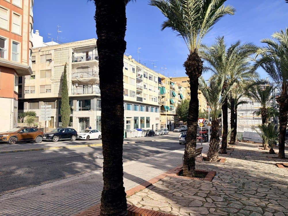 This charming top-floor apartment is located in Elche, just a short walk from some of the city’s most iconic landmarks and everyday conveniences. Situated on the last floor of the building without an elevator, the property offers a quiet living environment and plenty of natural light.With a total area of 48 m², the apartment is well distributed and features two comfortable bedrooms and one bathroom, making it ideal for couples, small families, or professionals. The property also includes a separate kitchen and a cozy living room, creating a practical and functional layout for everyday living.Both balconies have been enclosed, providing additional interior space and extend the living areas. The property has seen several improvements over the years, including the installation of modern laminate flooring throughout the apartment, updated kitchen fittings, and replaced windows that improve comfort and energy efficiency.One of the main advantages of this apartment is its excellent location. It is only a few meters from the Basilica of Santa María and Avenida de la Libertad, two of the most central and vibrant areas of Elche. Daily amenities, shops, cafés, and services are all within easy walking distance, while a bus stop is conveniently located directly in front of the building, providing easy connections across the city.The property is also located close to the University of Elche, which makes it a particularly attractive investment opportunity. The apartment has previously been rented to professionals working at the university, demonstrating its strong rental potential and demand in the area.Whether you are looking for a smart investment property with proven rental history or a comfortable home to live in year-round, this apartment represents an excellent opportunity. Elche is one of the most desirable cities in the province of Alicante, known for its rich history, beautiful palm groves, and vibrant local culture. The city is also very well connected, located only a few minutes by car from Alicante city and Alicante–Elche Airport, making travel and commuting extremely convenient.
