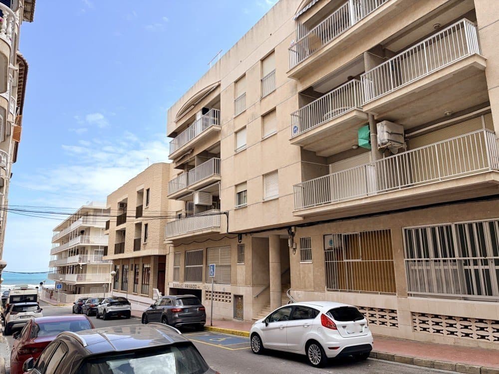 Discover this superb apartment located in a prime area of Guardamar del Segura,just 100 metres from its beautiful, expansive sandy beaches. A unique opportunity to enjoy the Mediterranean lifestyle with stunning sea views from the comfort of your own home.Situated on the third floor with lift access, the property offers a well-designed and bright layout. It features 3 bedrooms, ideal for families or those seeking additional space for guests or remote working, along with 2 fully equipped and renovated bathrooms. The apartment has been partially refurbished, blending modern updates with the property’s original character.The living room provides a warm and inviting atmosphere, with open views towards the sea, creating the perfect setting for relaxation and leisure. The kitchen is practical and efficiently arranged, complementing the overall functionality of the home.oLocated in a well-established neighbourhood, the property ensures tranquillity and privacy while remaining within easy walking distance of all amenities, including supermarkets, restaurants, pharmacies, and leisure areas.As an added benefit, the property includes a private parking space and a storage room, offering extra convenience and valuable storage capacity, especially important in coastal locations.Guardamar del Segura is a charming coastal town renowned for its more than 11 kilometres of natural beaches, protected pine forests, and pleasant climate all year round. It is an ideal destination both for permanent living and holiday stays, thanks to its relaxed atmosphere and excellent connections to other areas of the Costa Blanca.